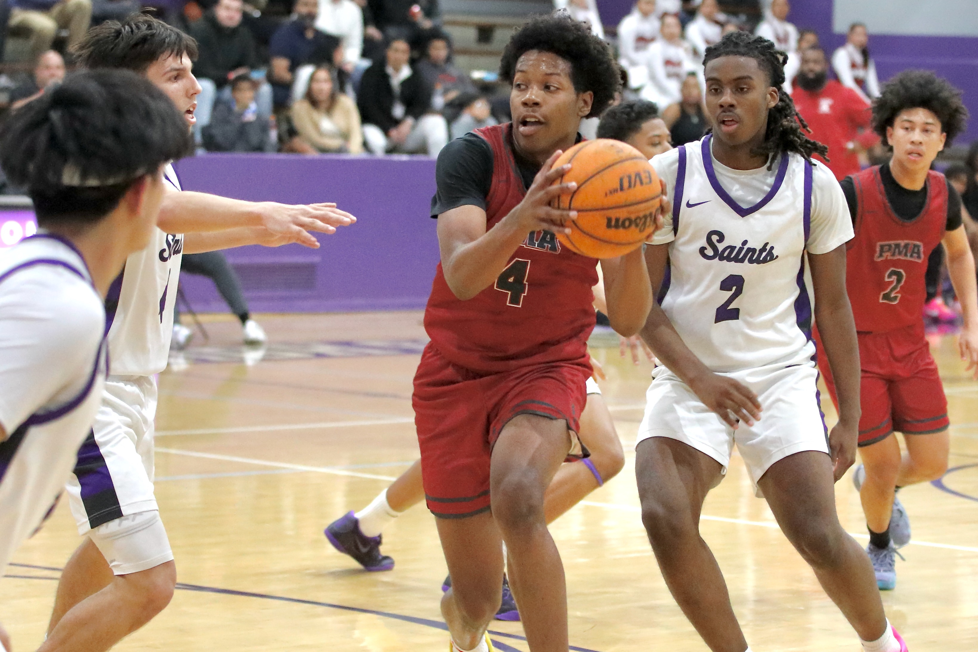 St. Pius X-St. Matthiasâ Dayvion Gates drives through St. Anthonyâs...