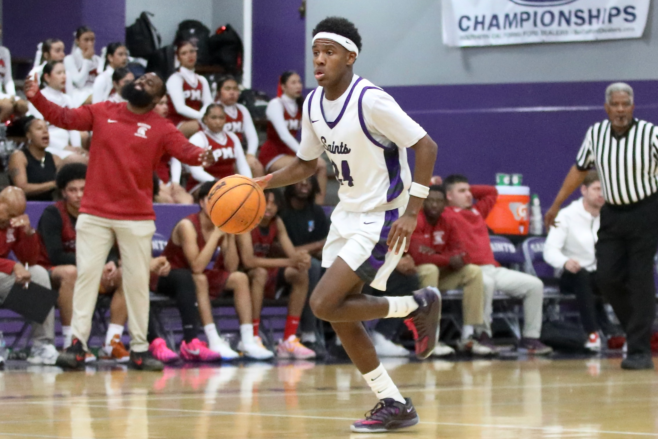 St. Anthony’s Jamil House dribbles out of the backcourt against...