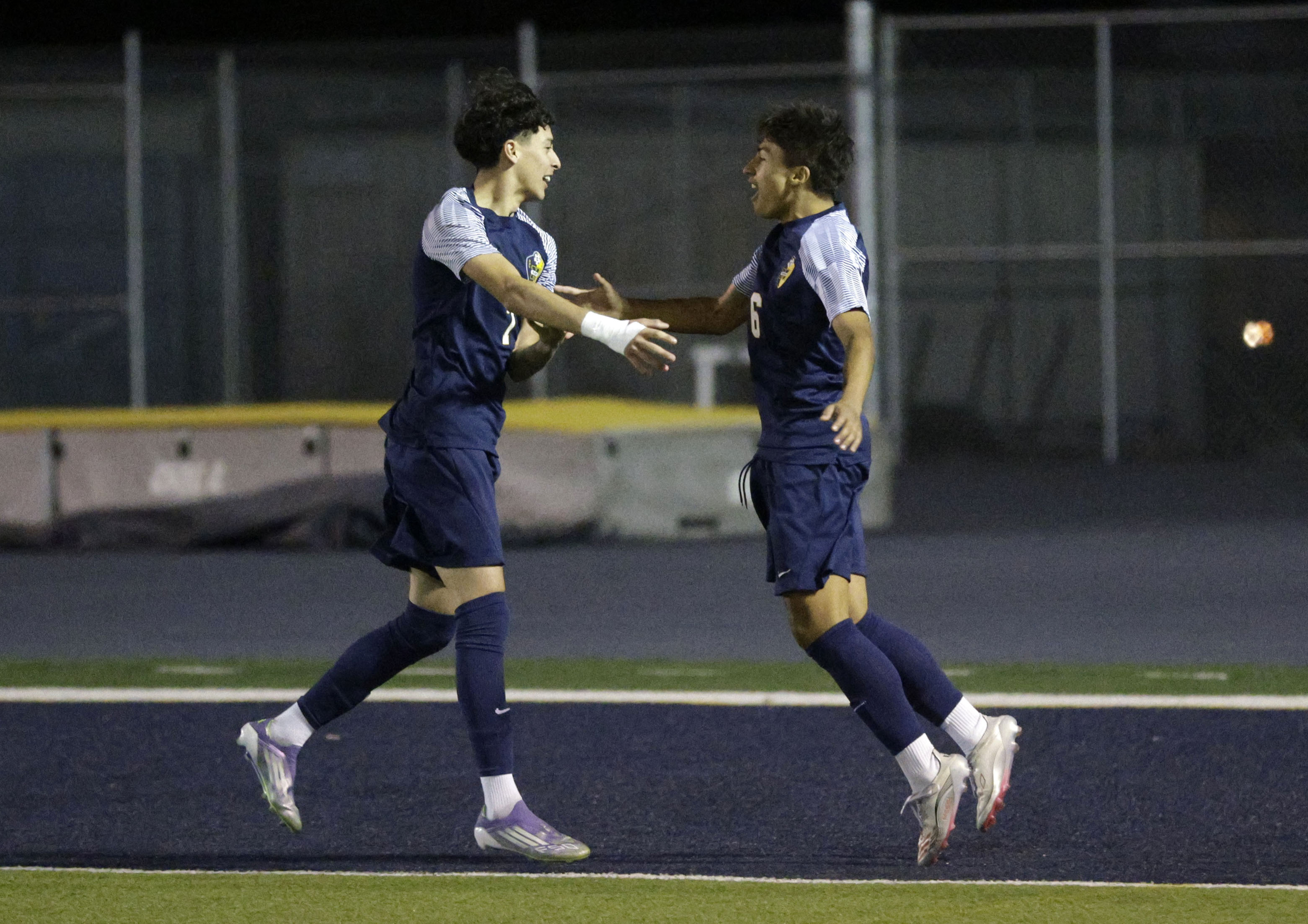 Millikan’s Sebastian Vegas (7) celebrates with Dario Garcia (6) after...