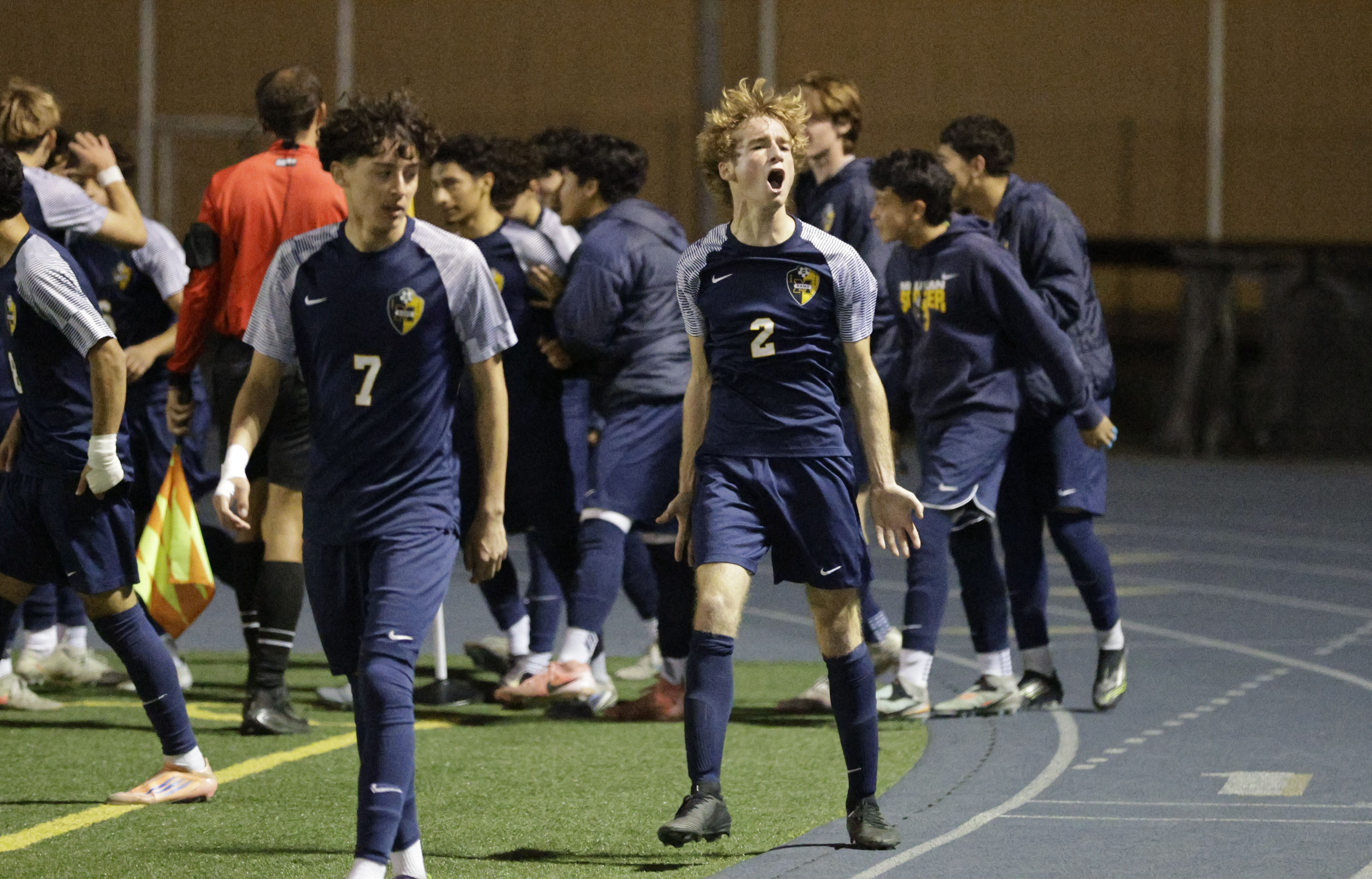 Millikan’s Ethan Weinman tries to hype up the crowd after...