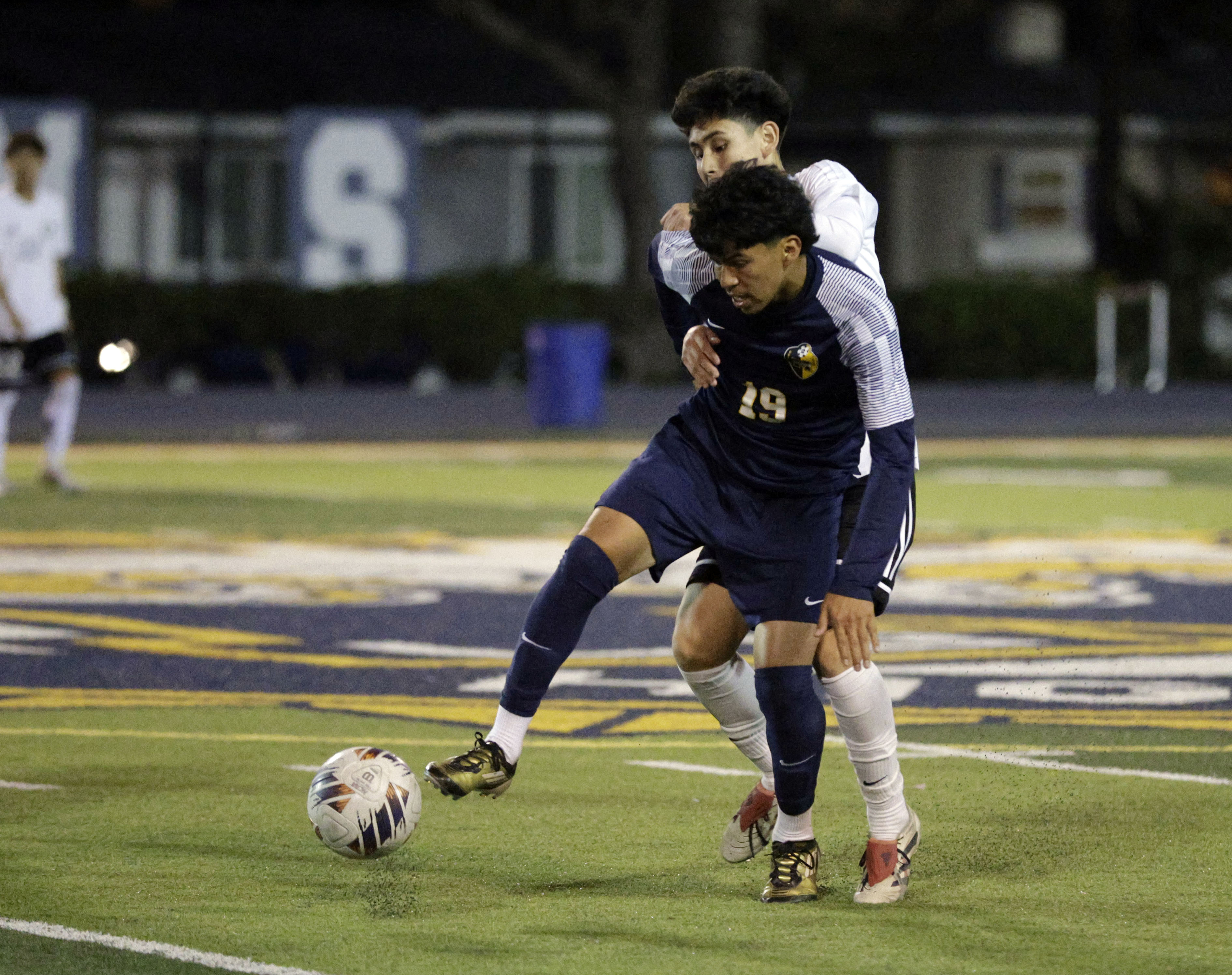 Millikan’s Matthew Resendiz (19) tries to keep the ball from...