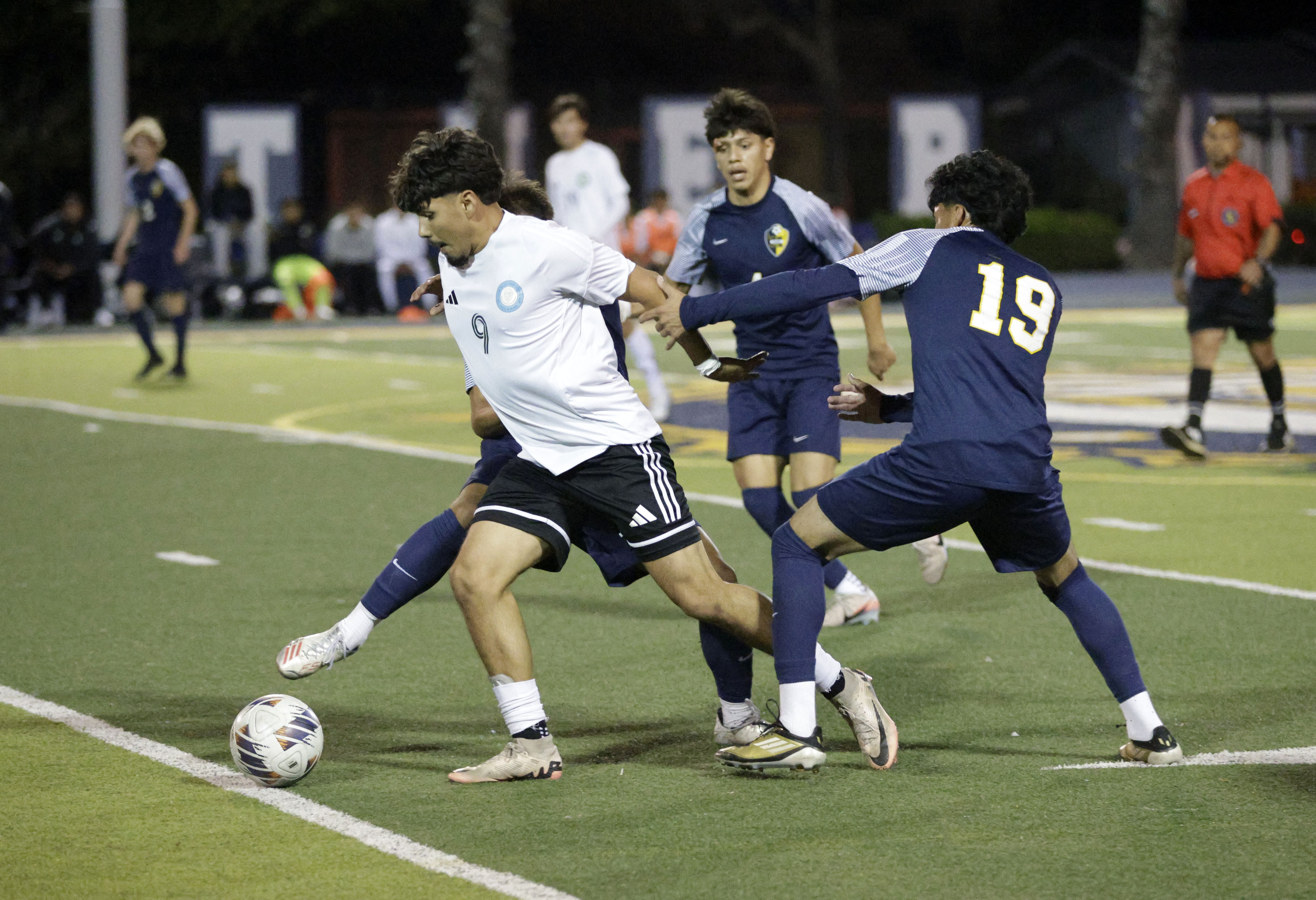 Long Beach Poly’s Alfaro Salvador (9) breaks through Millikan’s Matthew...