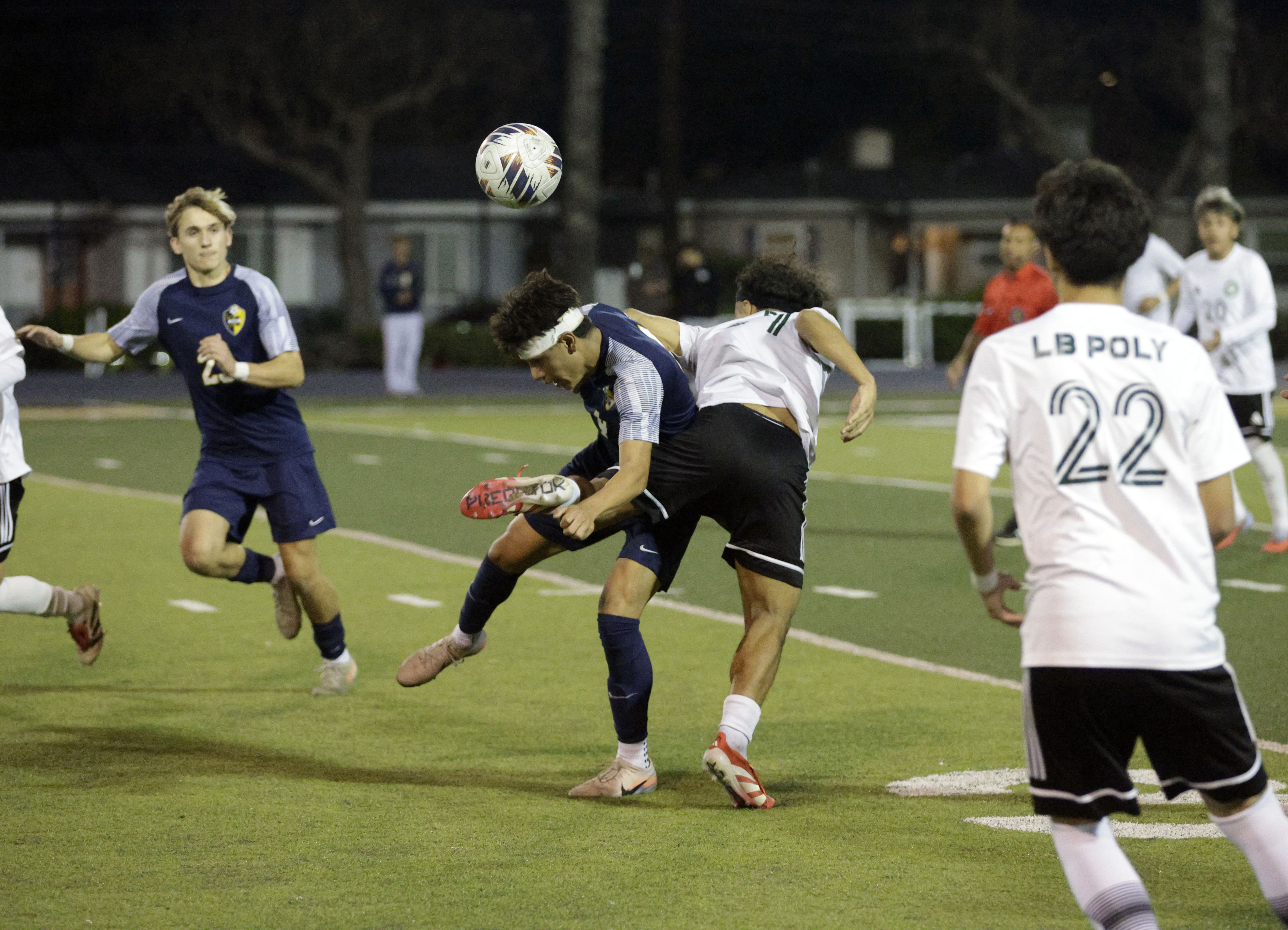Millikan’s Ivan Cervantes Vega (4) and Long Beach Poly’s Roger...