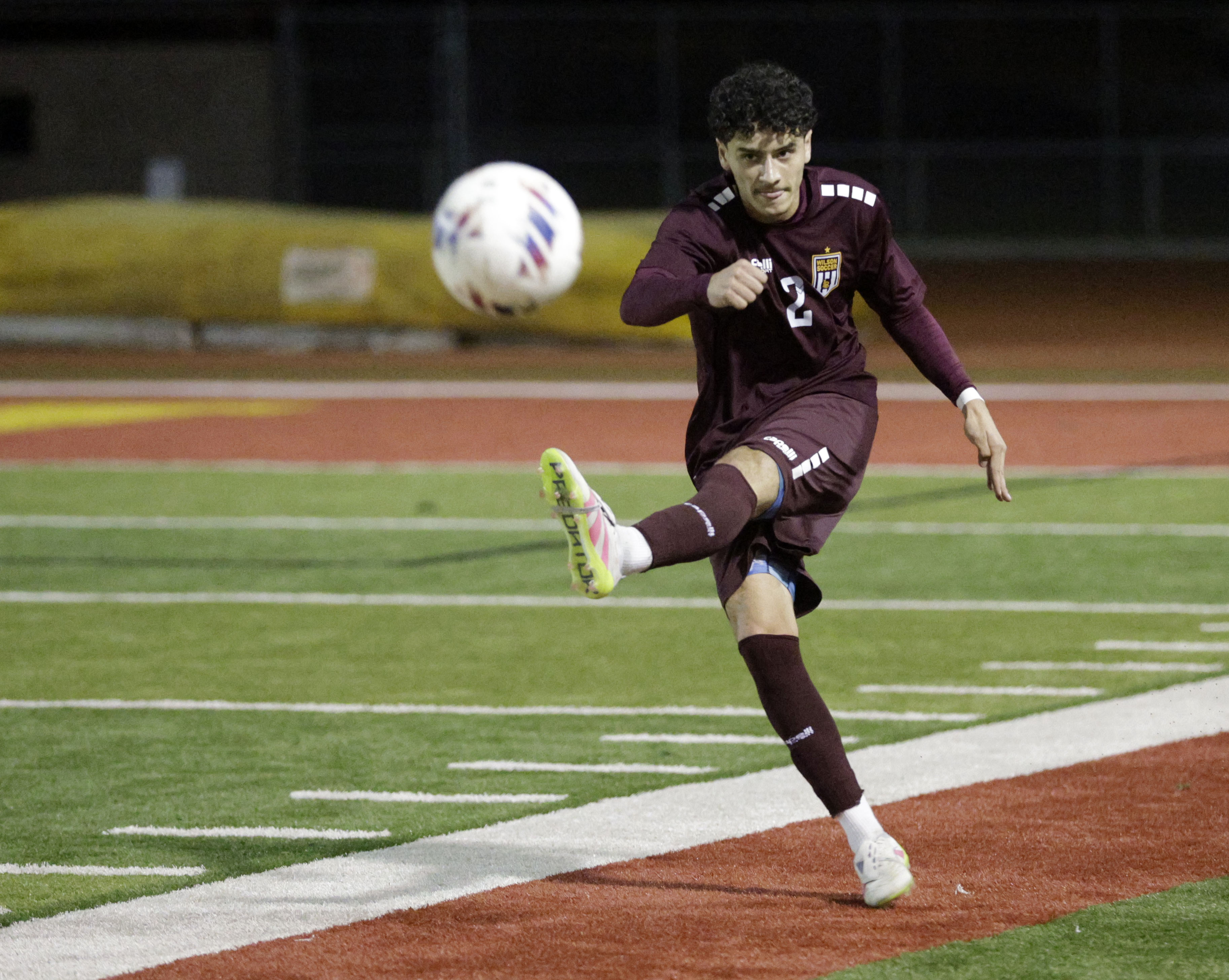 Wilson’s Diego Garrido (2) kicks the ball down field as...