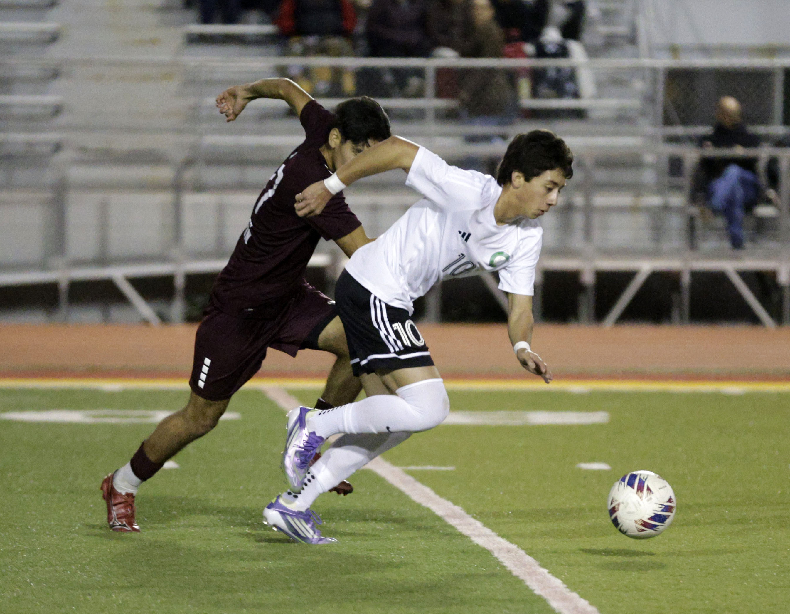 Long Beach Poly’s Matthew Sanchez (10) pushes the ball past...