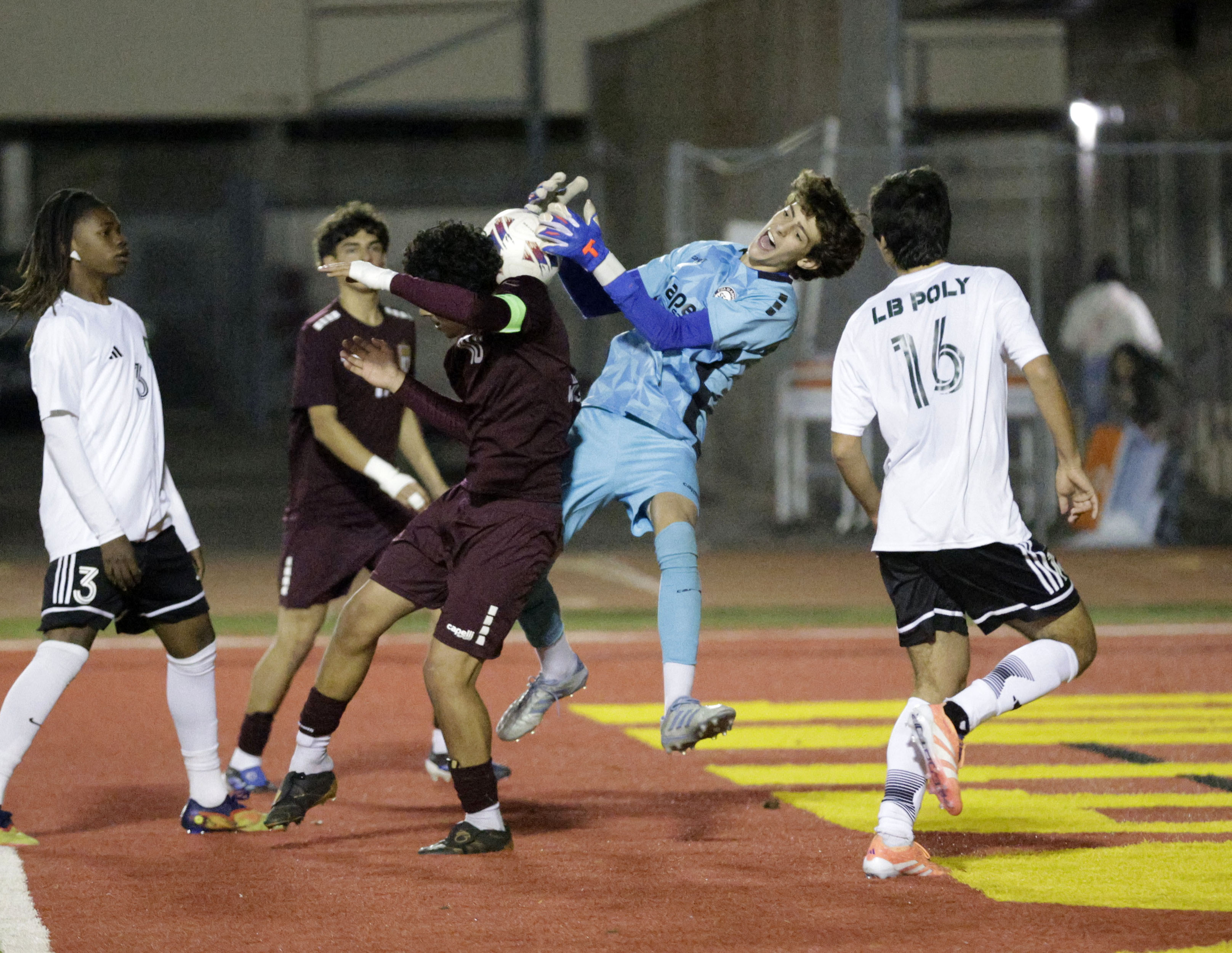 Long Beach Poly’s Mekiah Twal (1) stops the goal attempt...