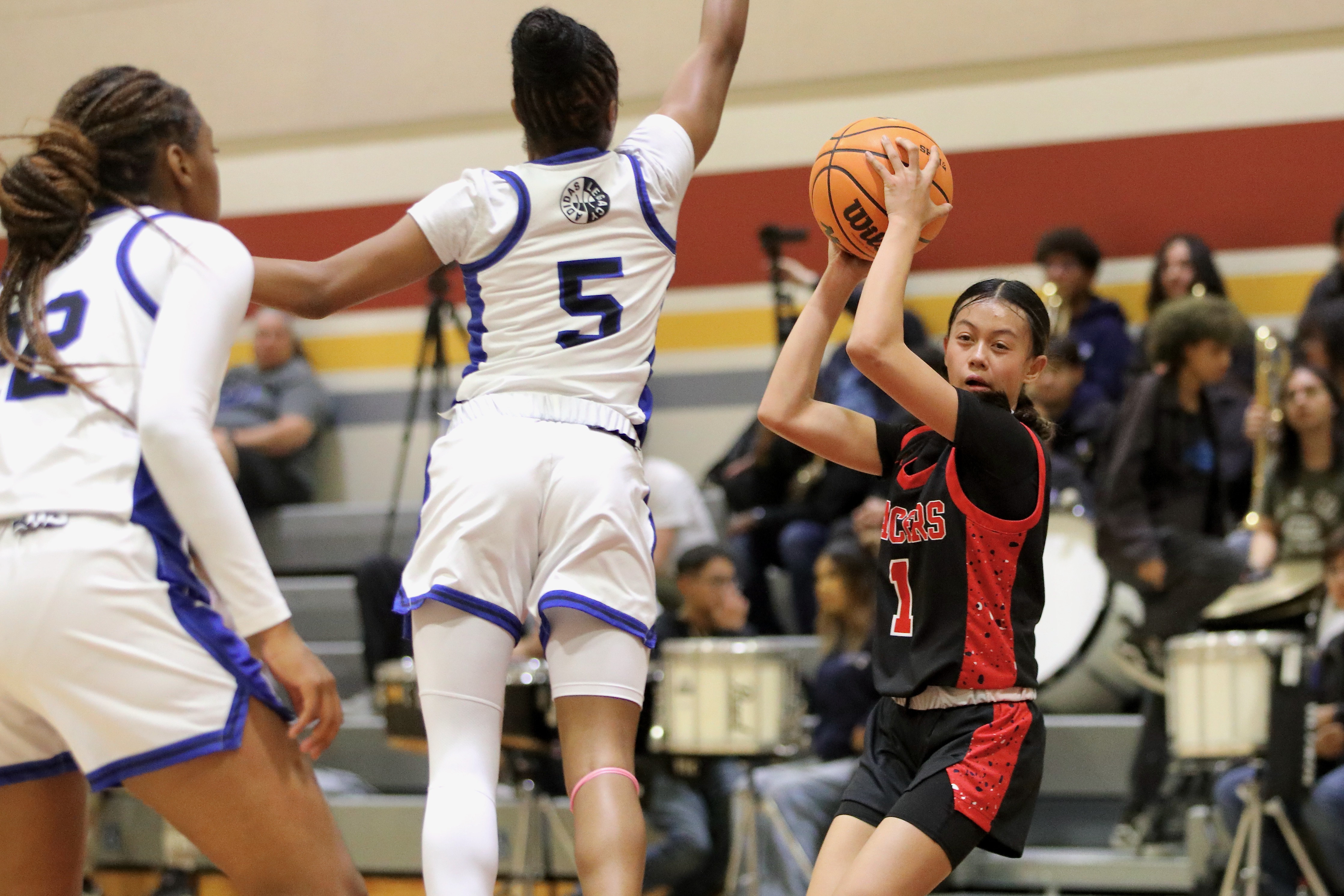 Lakewood freshman guard Leilah Sieng tries to evade Jordanâs defense...