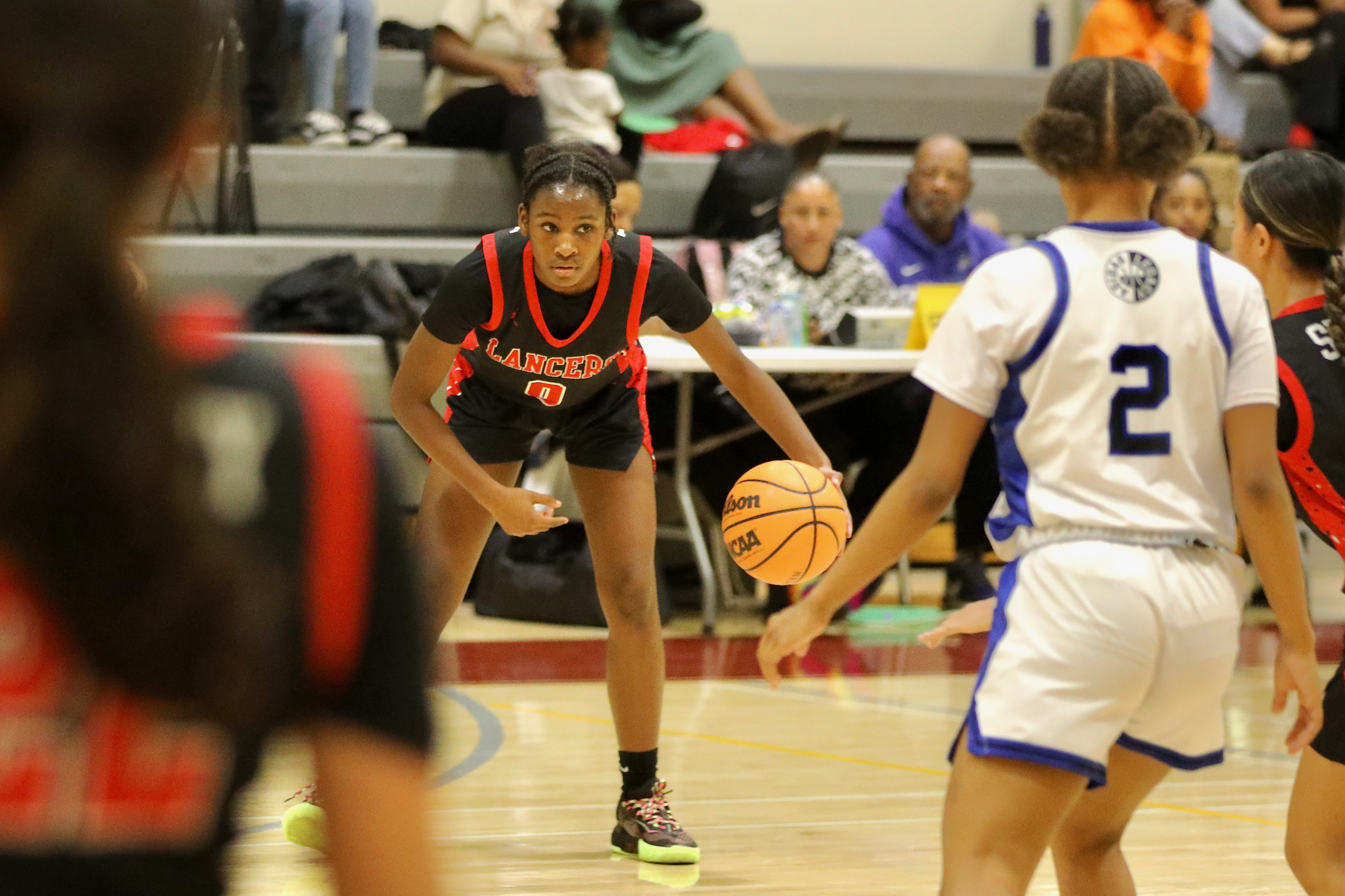 Lakewood freshman Aniyah Lindsey looks for an opening against Jordan...