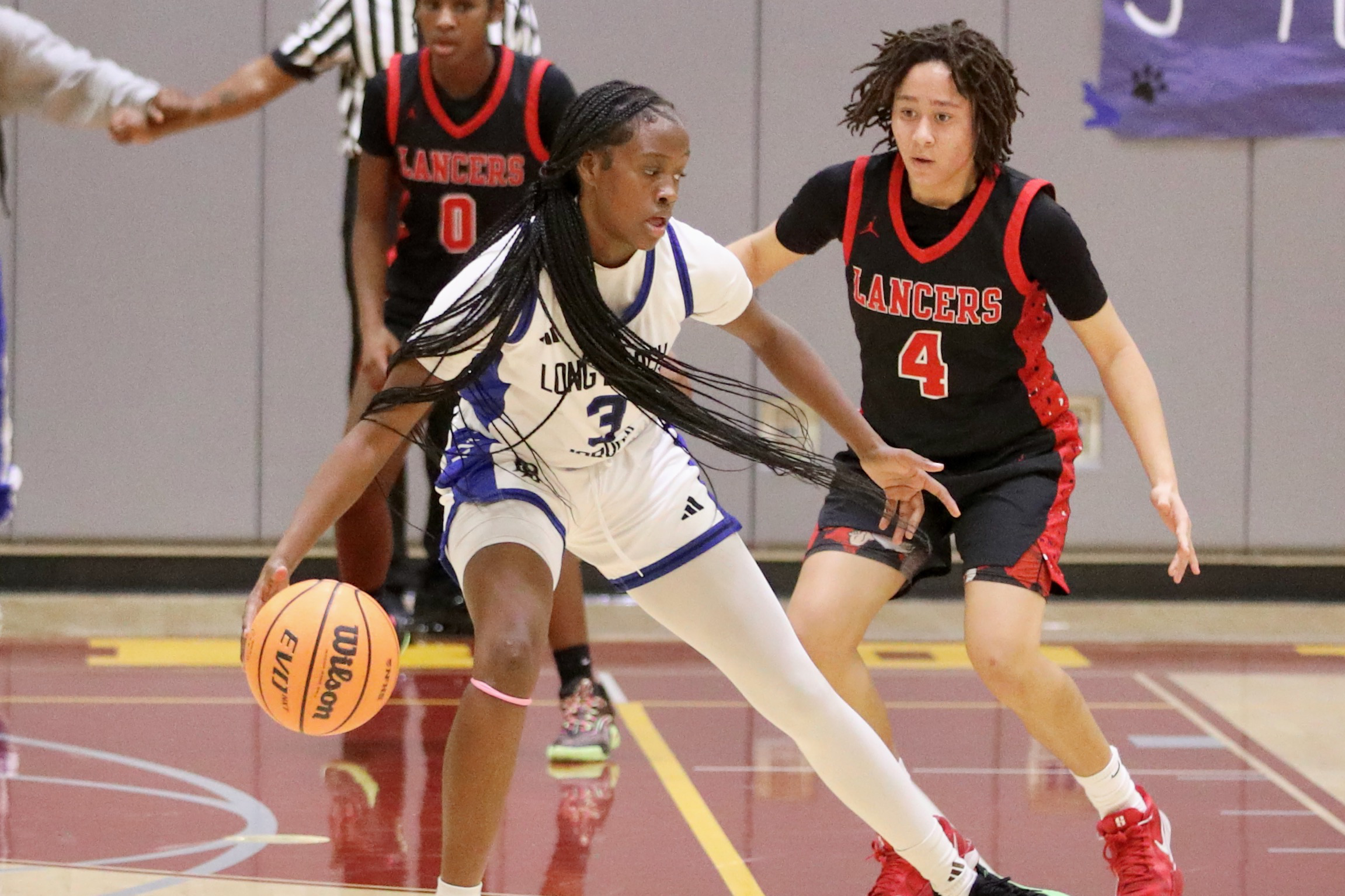 Jordan senior Jahâasharee Moore dribbles against Lakewood sophomore Mahlia Simmons...