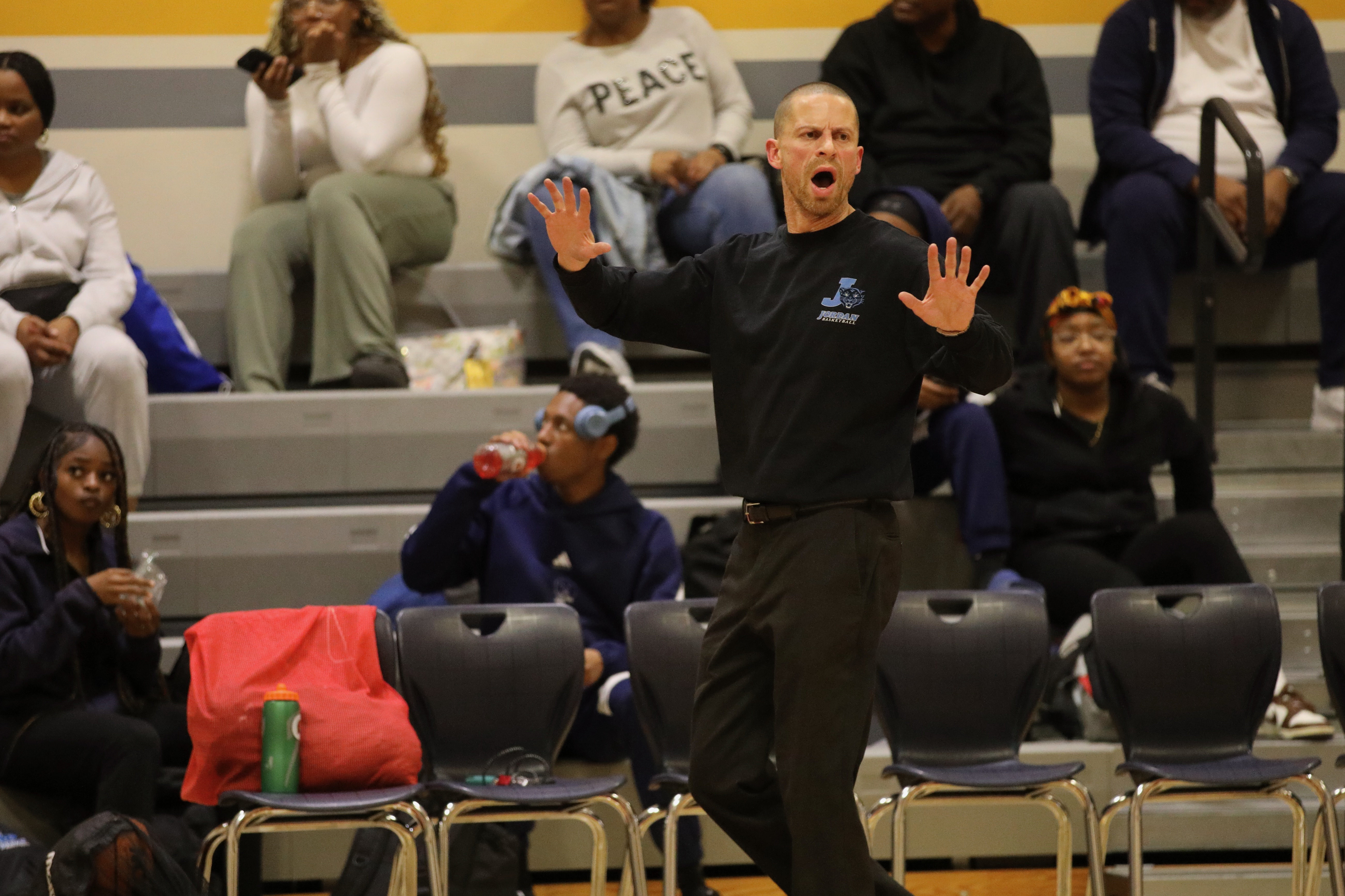 Jordan head coach Wesley Rosenbaum reacts on the sideline during...