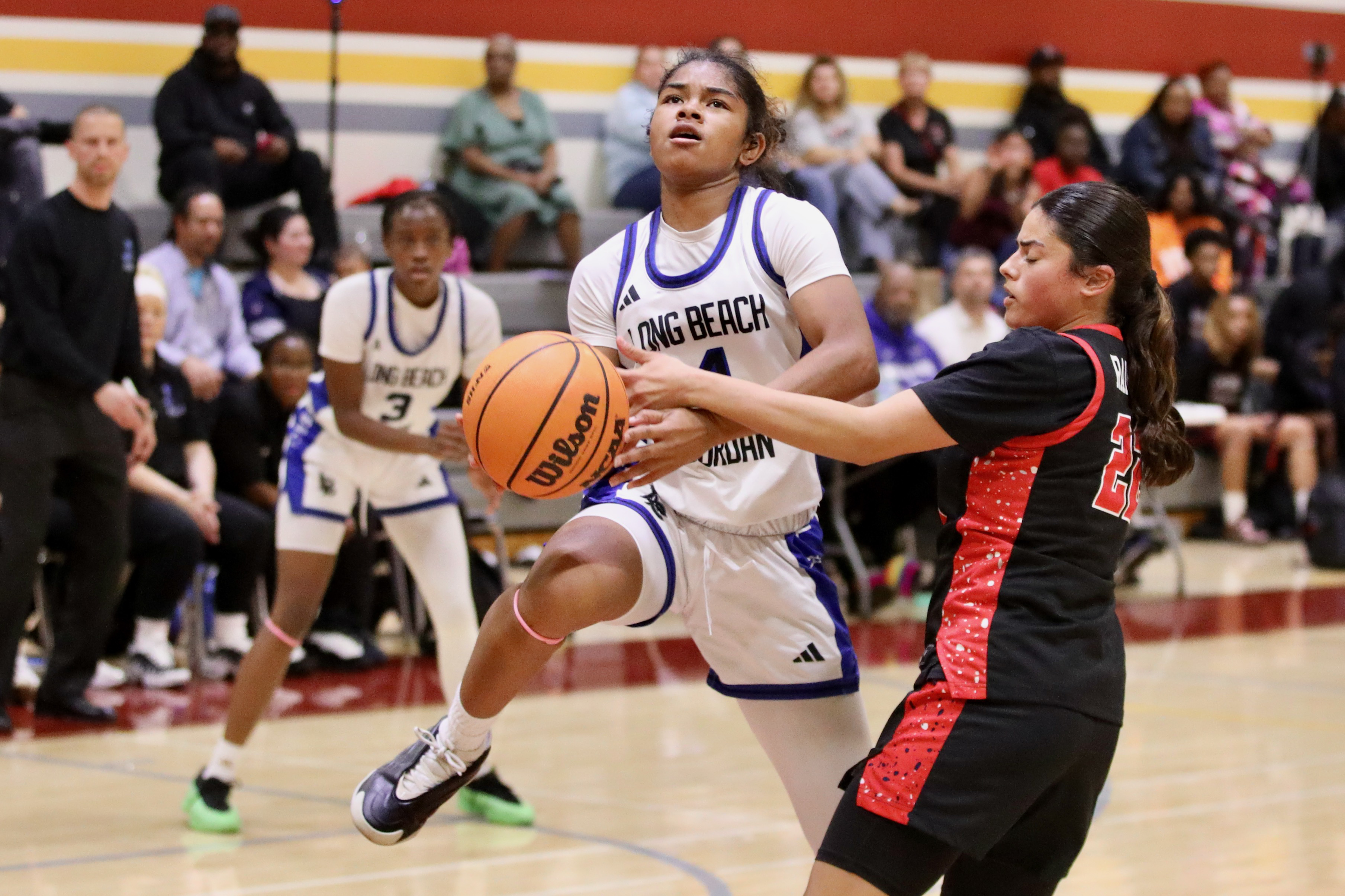 Jordanâs Janiah Lorn is fouled as she drives down the...