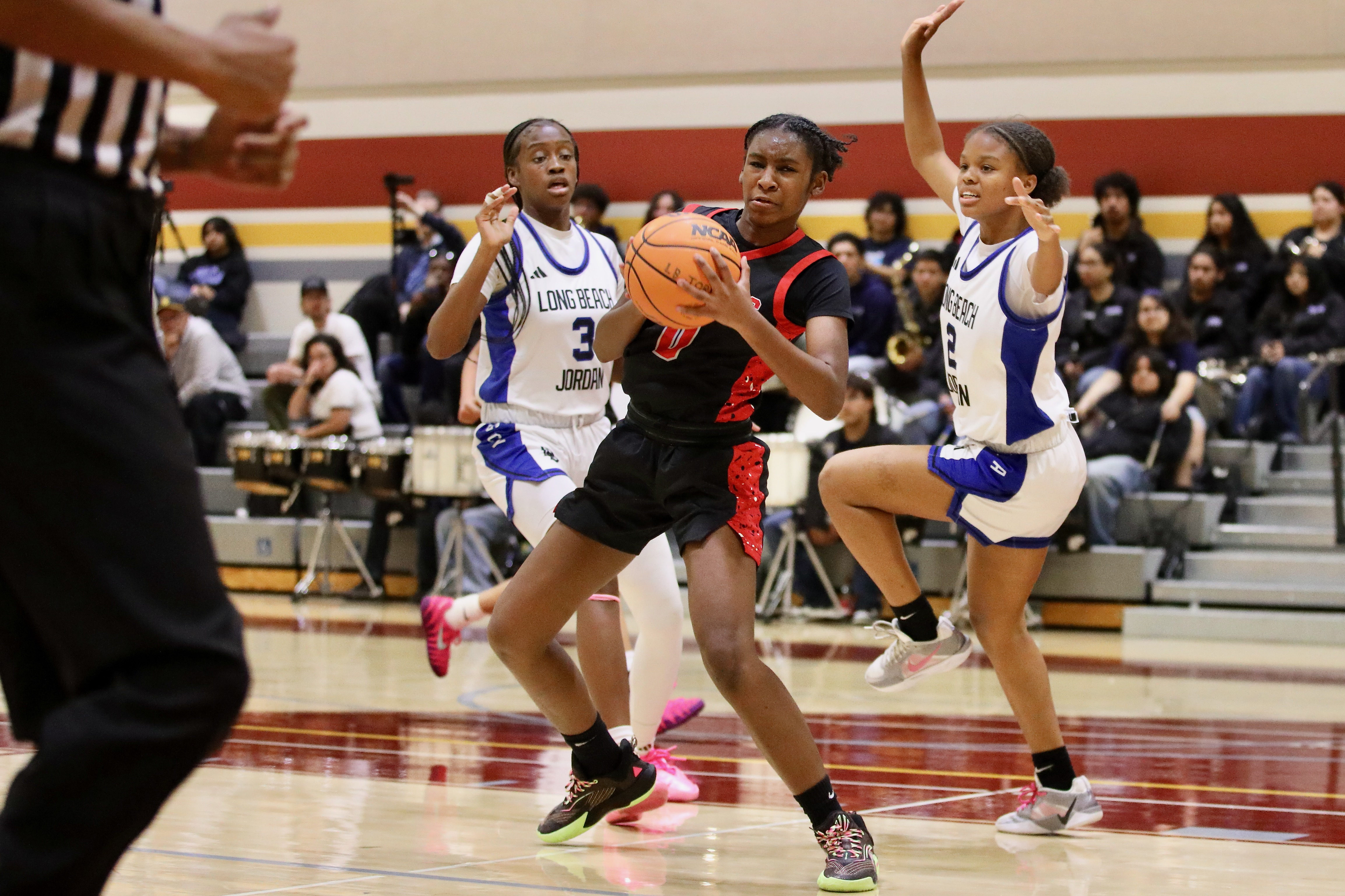 Lakewood freshman Aniyah Lindsey splits the Jordan defense as she...