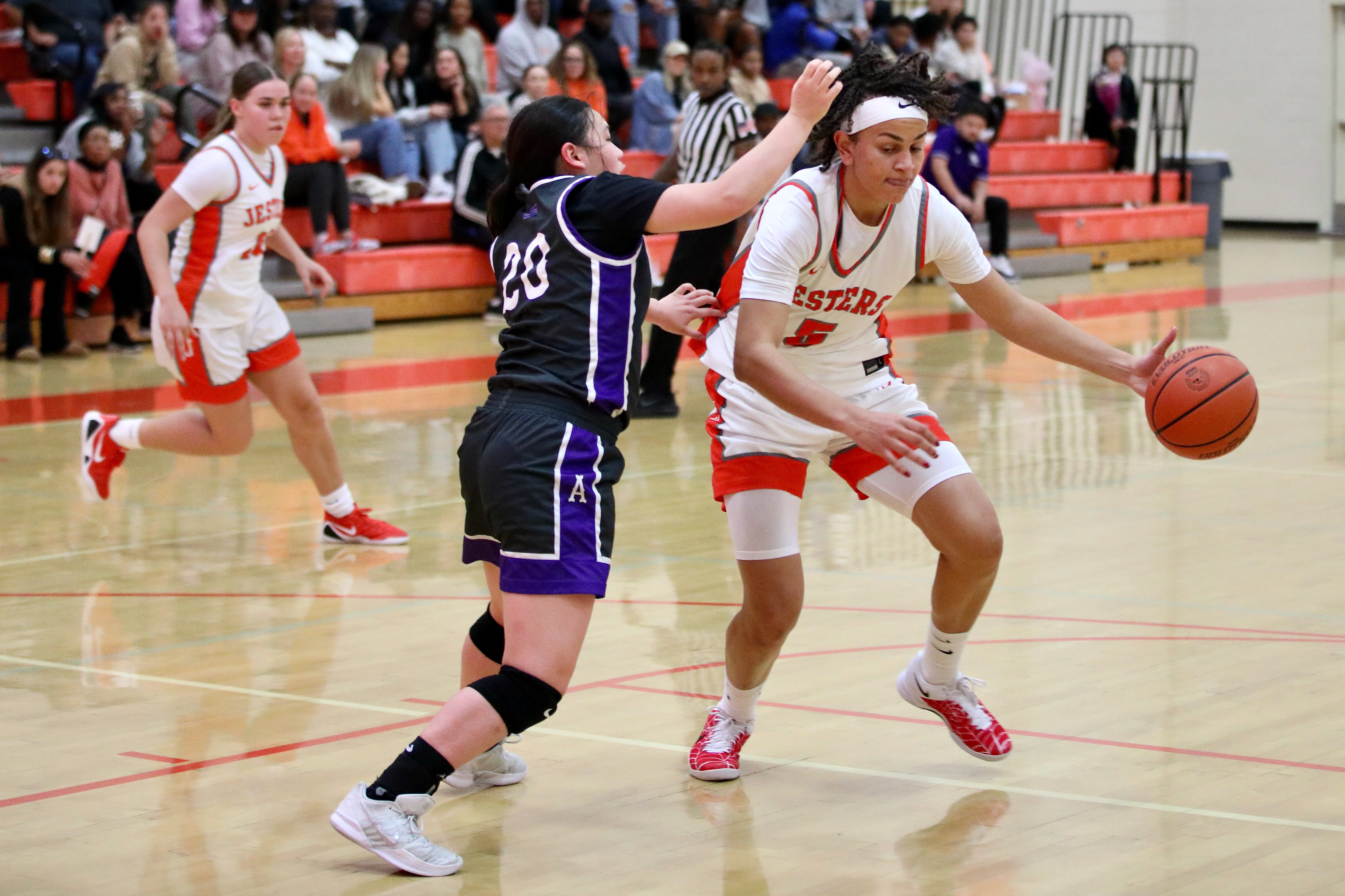 St. Josephâs Bella Harmon drives against St. Anthonyâs Ayaka Yiu...