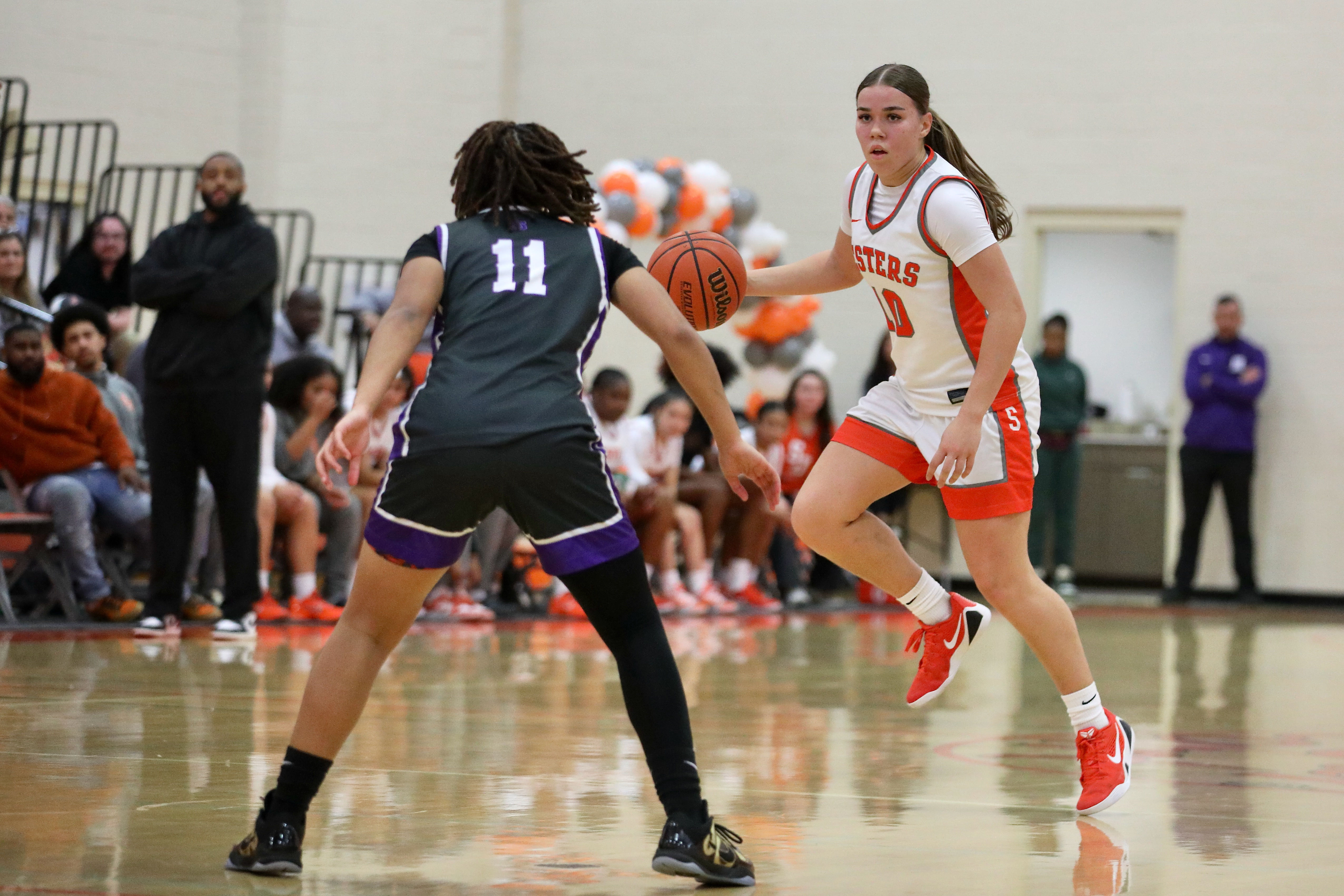 St. Joseph’s Mia Minshall dribbles up court towards St. Anthonyâs...