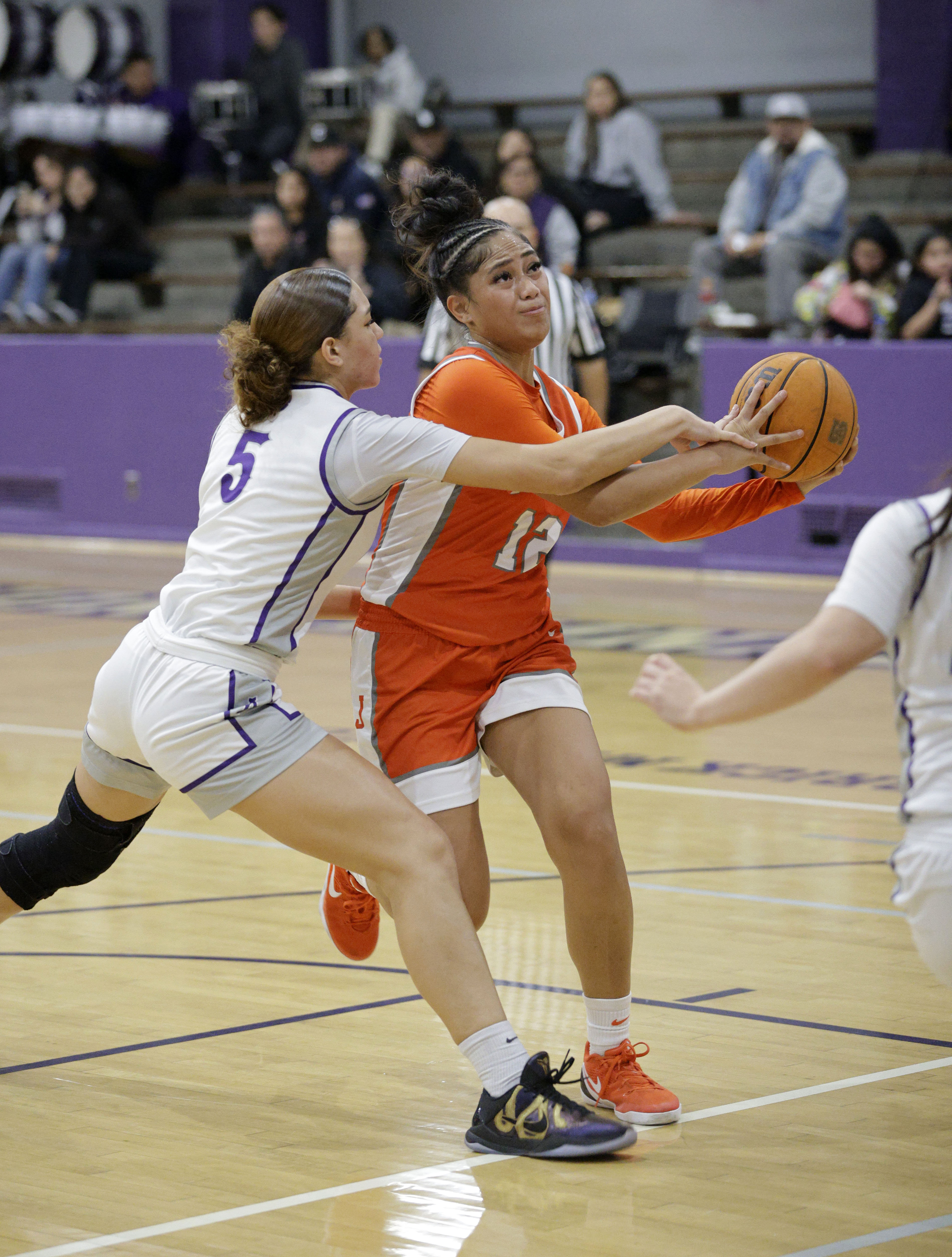 St. Anthonys Dallyn Knox (5) tries to steal the ball...