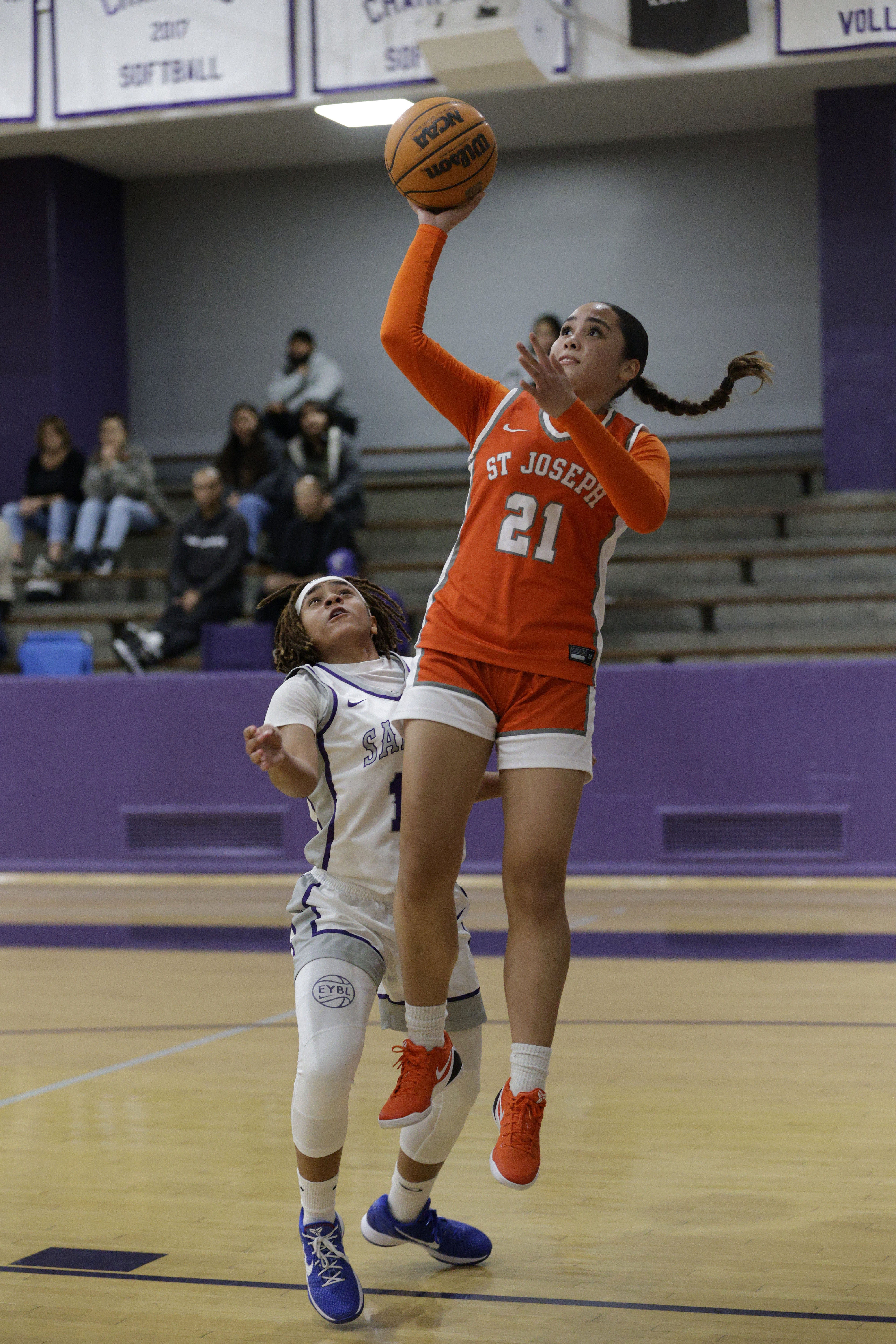 St. Josephs Olivia Molina (21) goes up for the shot...