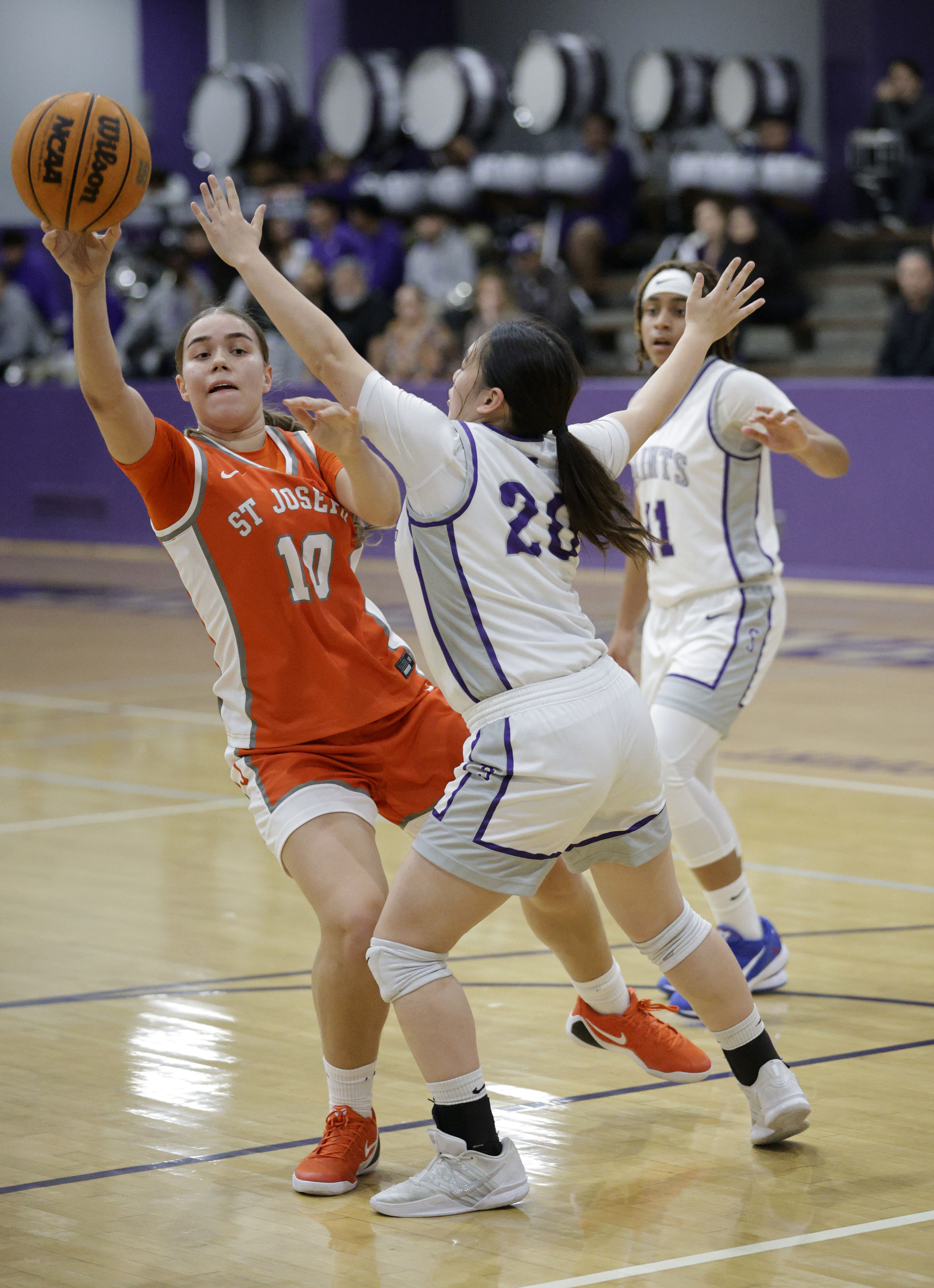 St. Anthonys Ayaka Yiu (20) puts the pressure on St....