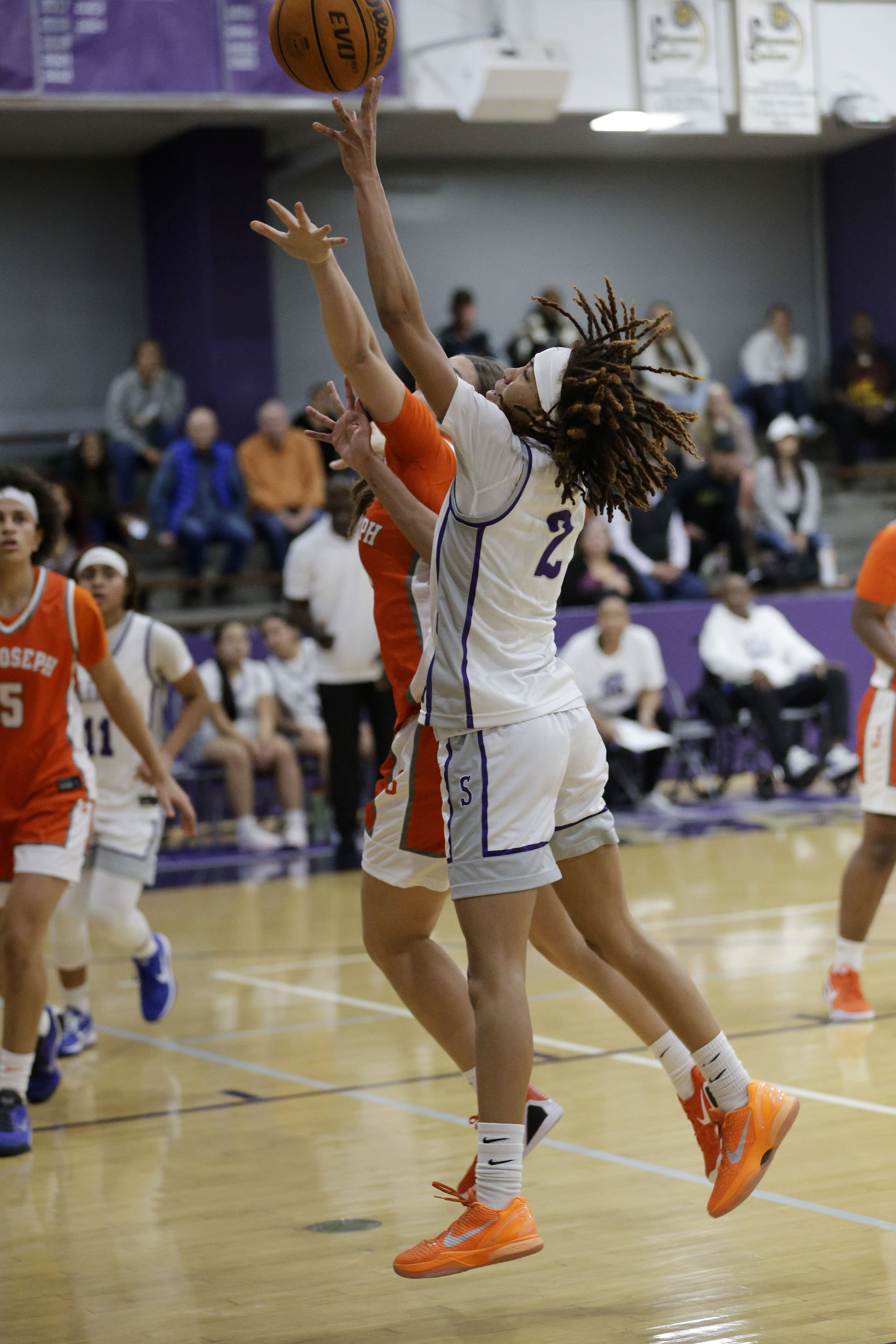 St. Anthonys Laila Hughs (2) shoots for two as the...
