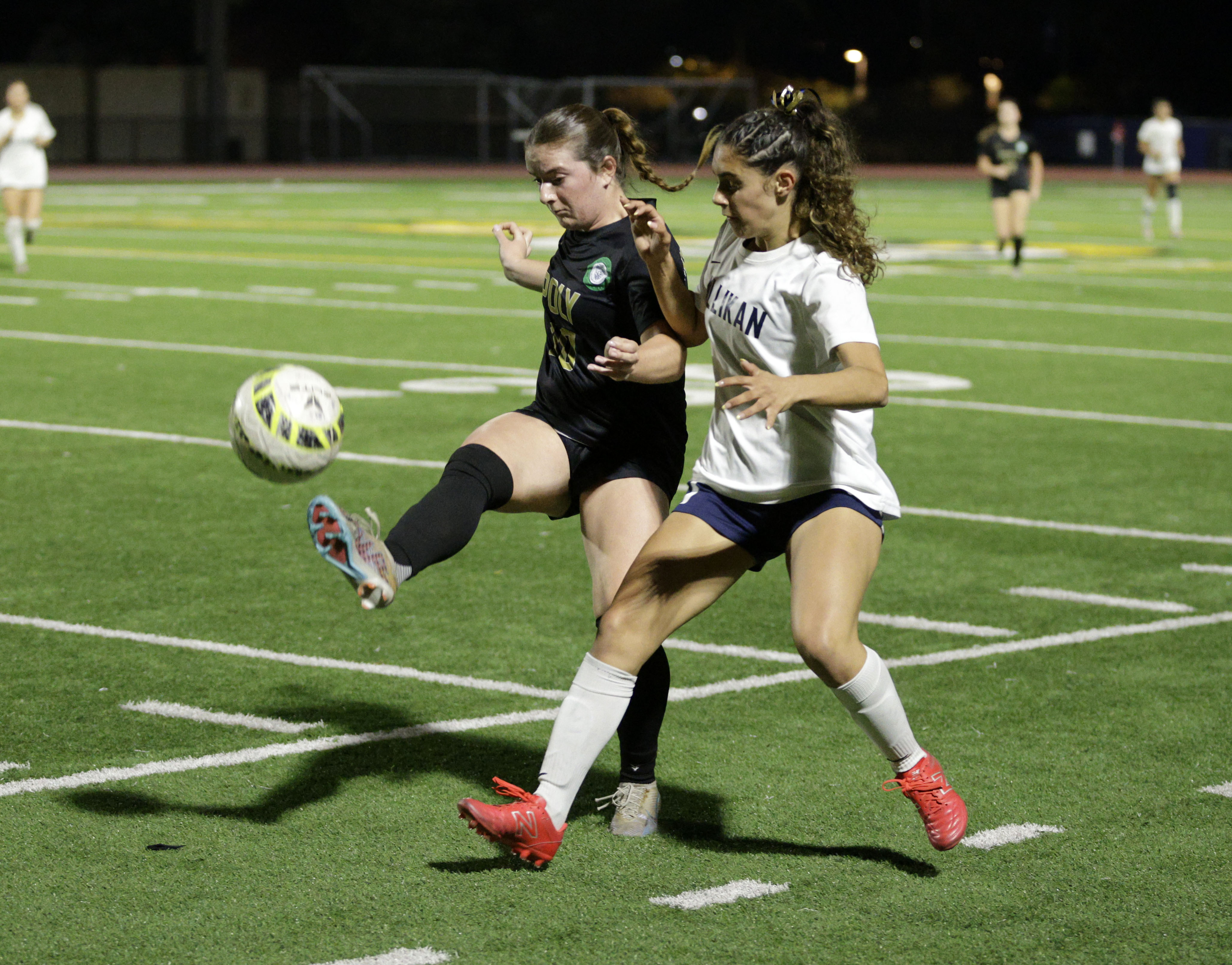 Long Beach Poly’s Maired McGovern (10) kicks the ball away...