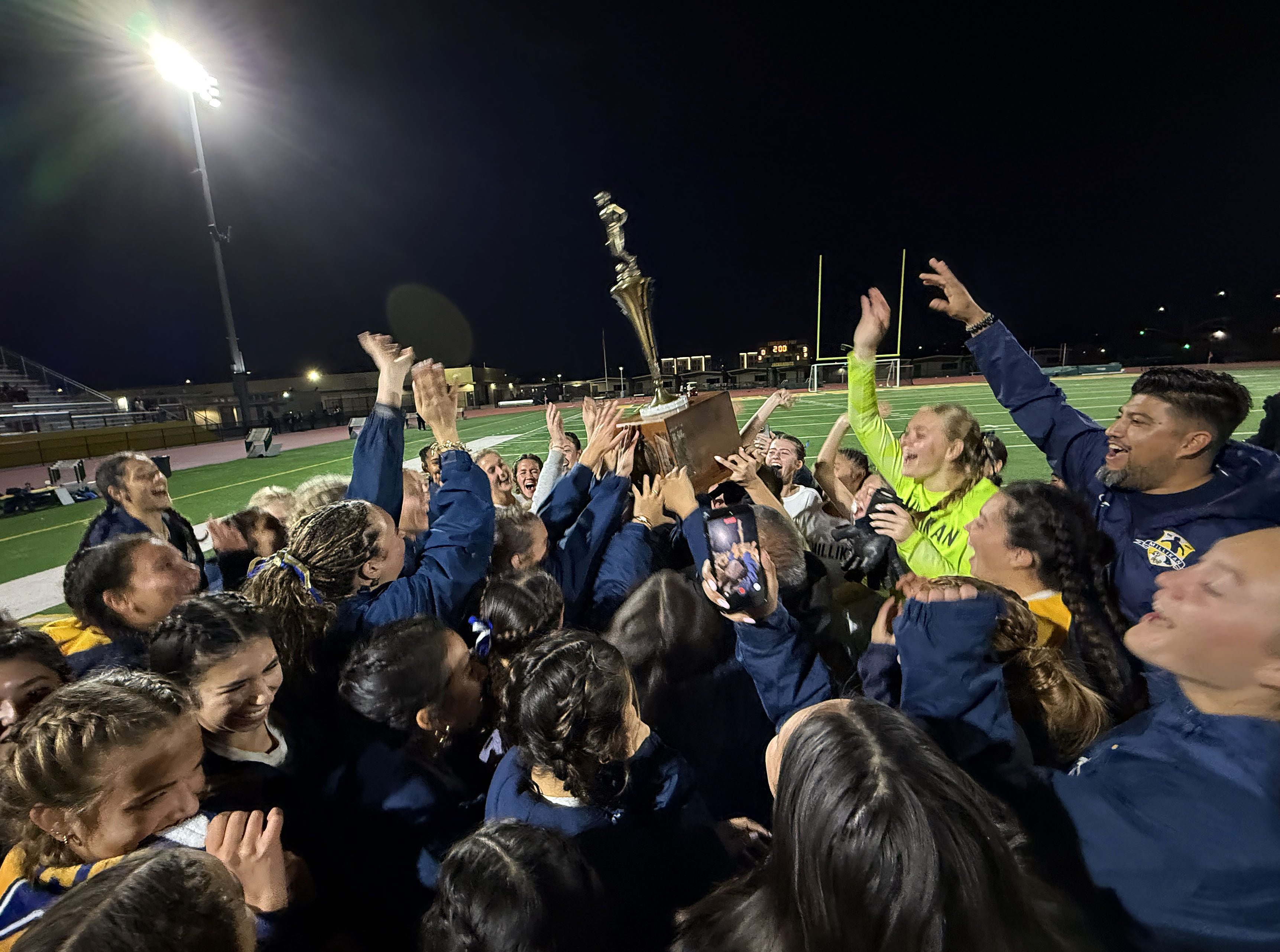 Millikan’s girls soccer team celebrate their win over Long Beach...