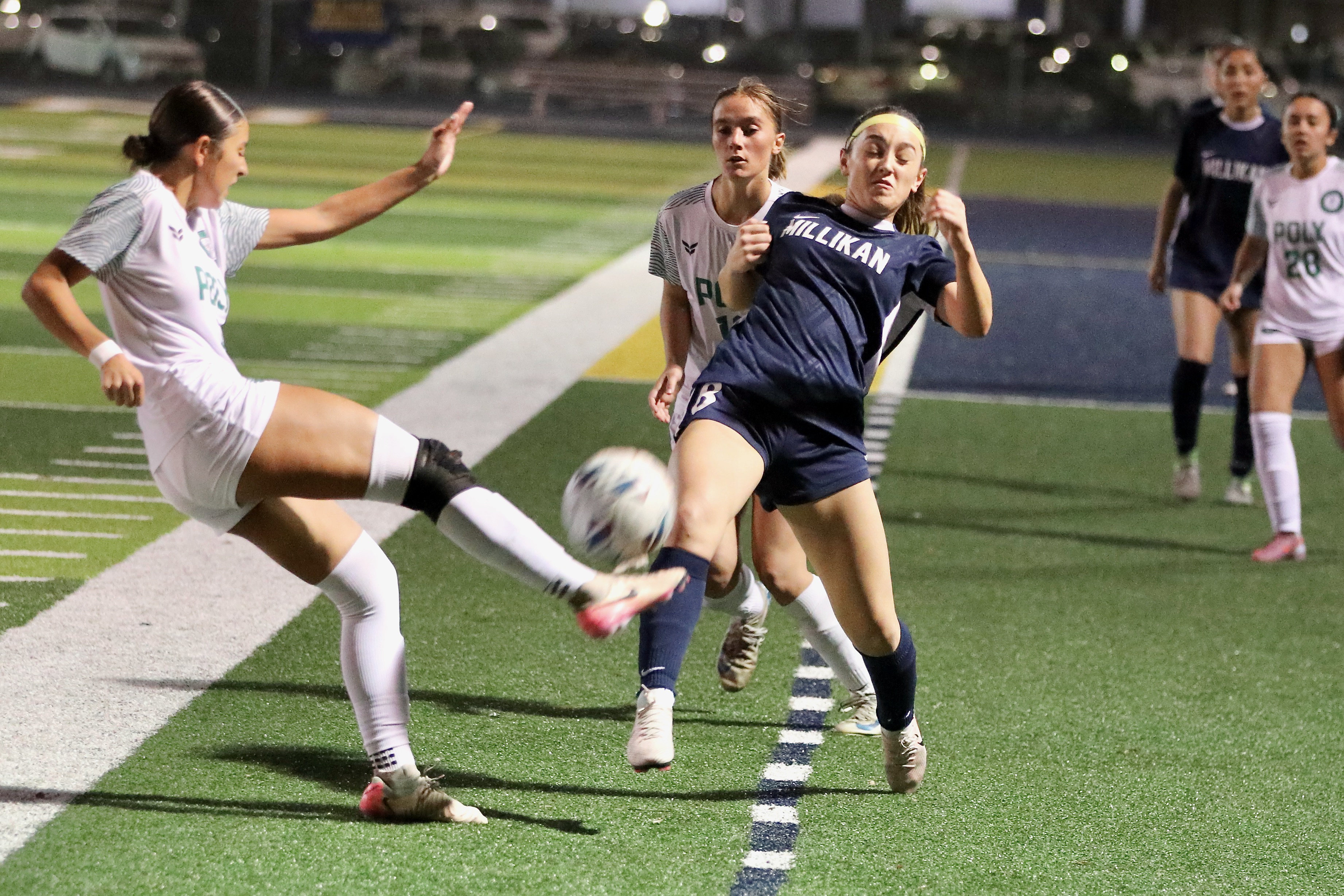 Millikanâs London Perez winces as Long Beach Polyâs Kamelah Artiago...