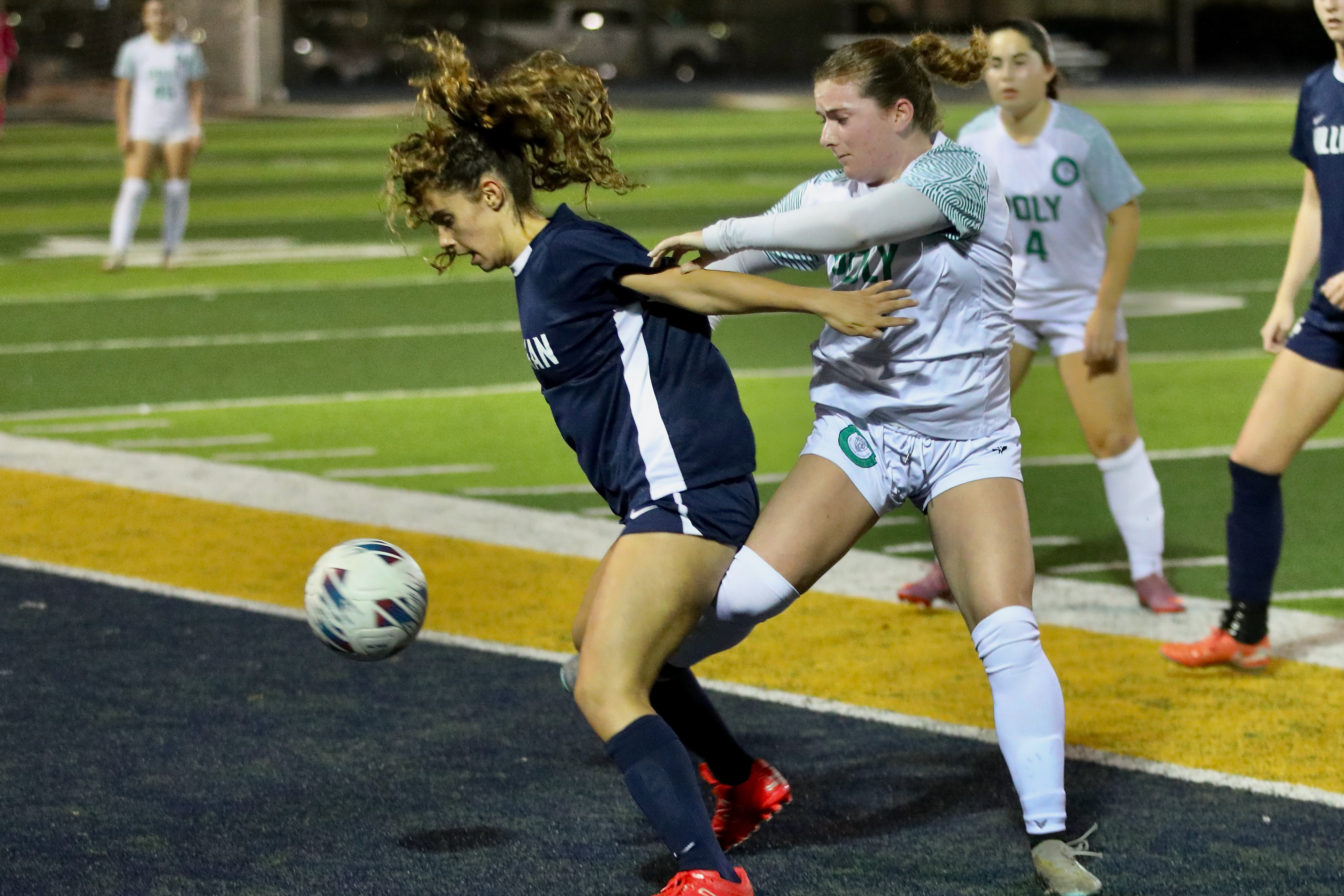 Millikanâs Elle Aoun, left, fights to keep a ball in...