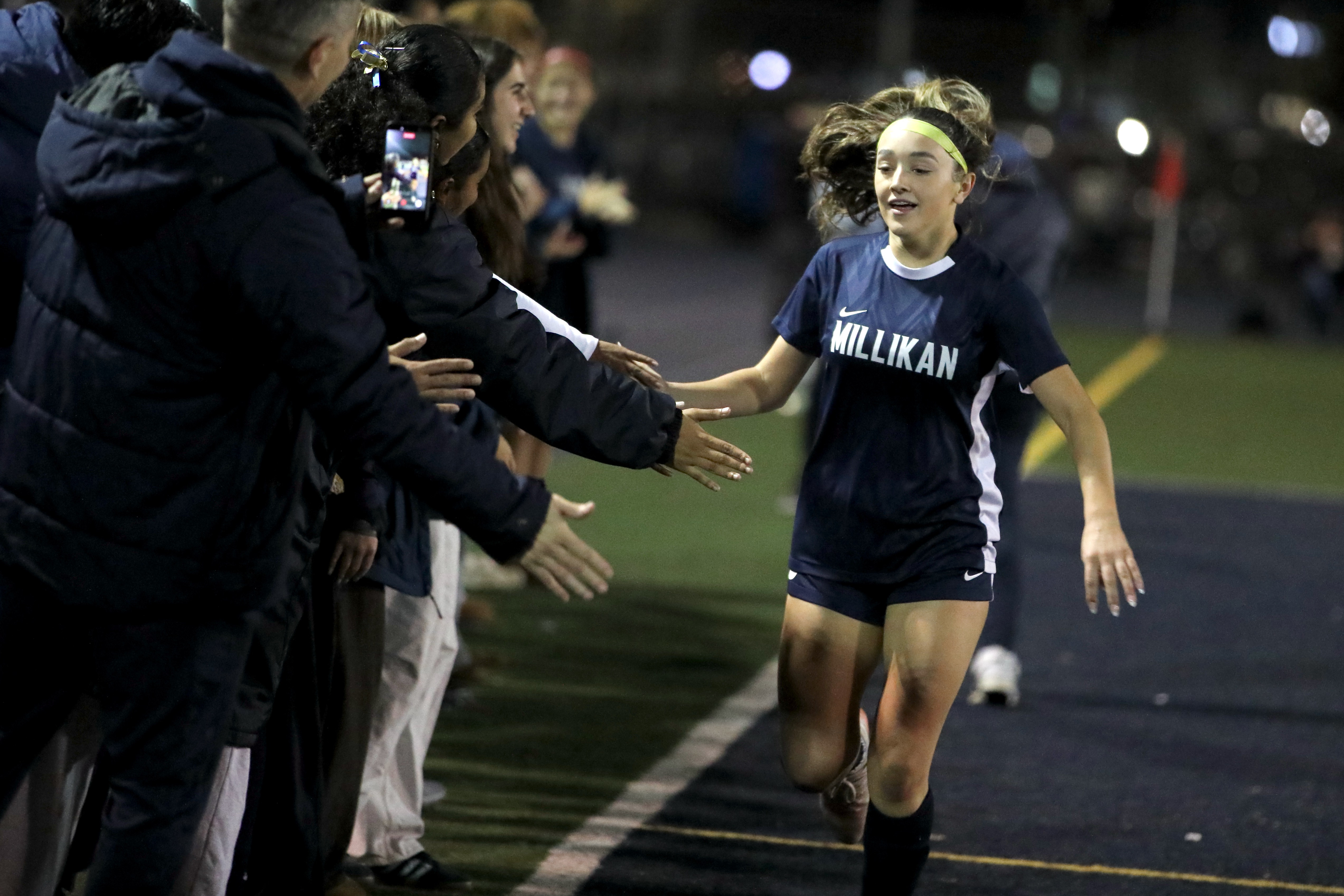 Millikan’s Caoimhe Tighe is congratulated by teammates after the senior...