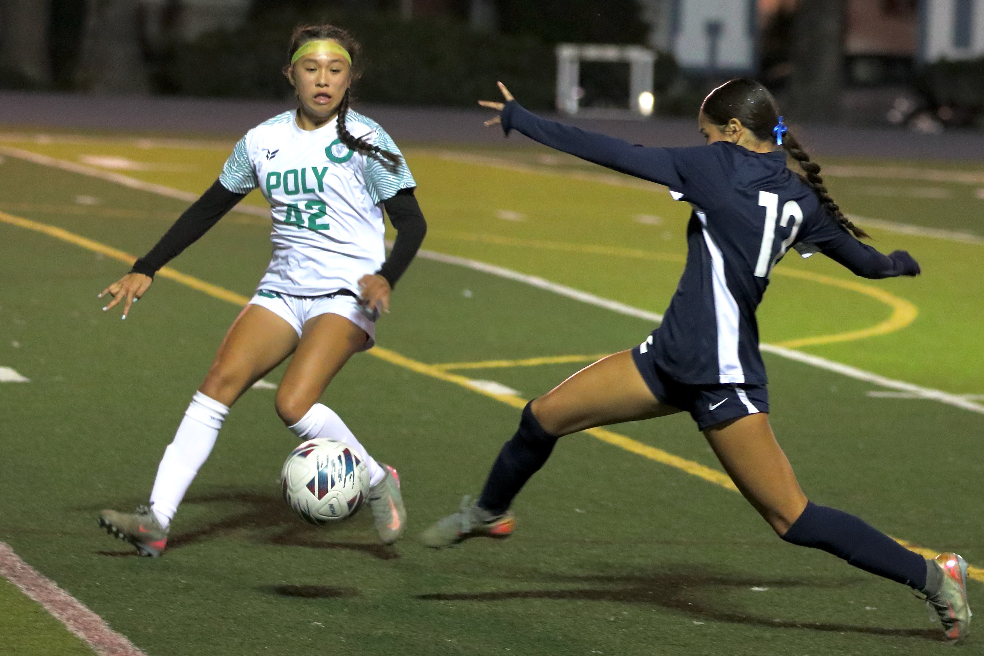 Long Beach Polyâs Rylee Zavala (#42) defends against a streaking...
