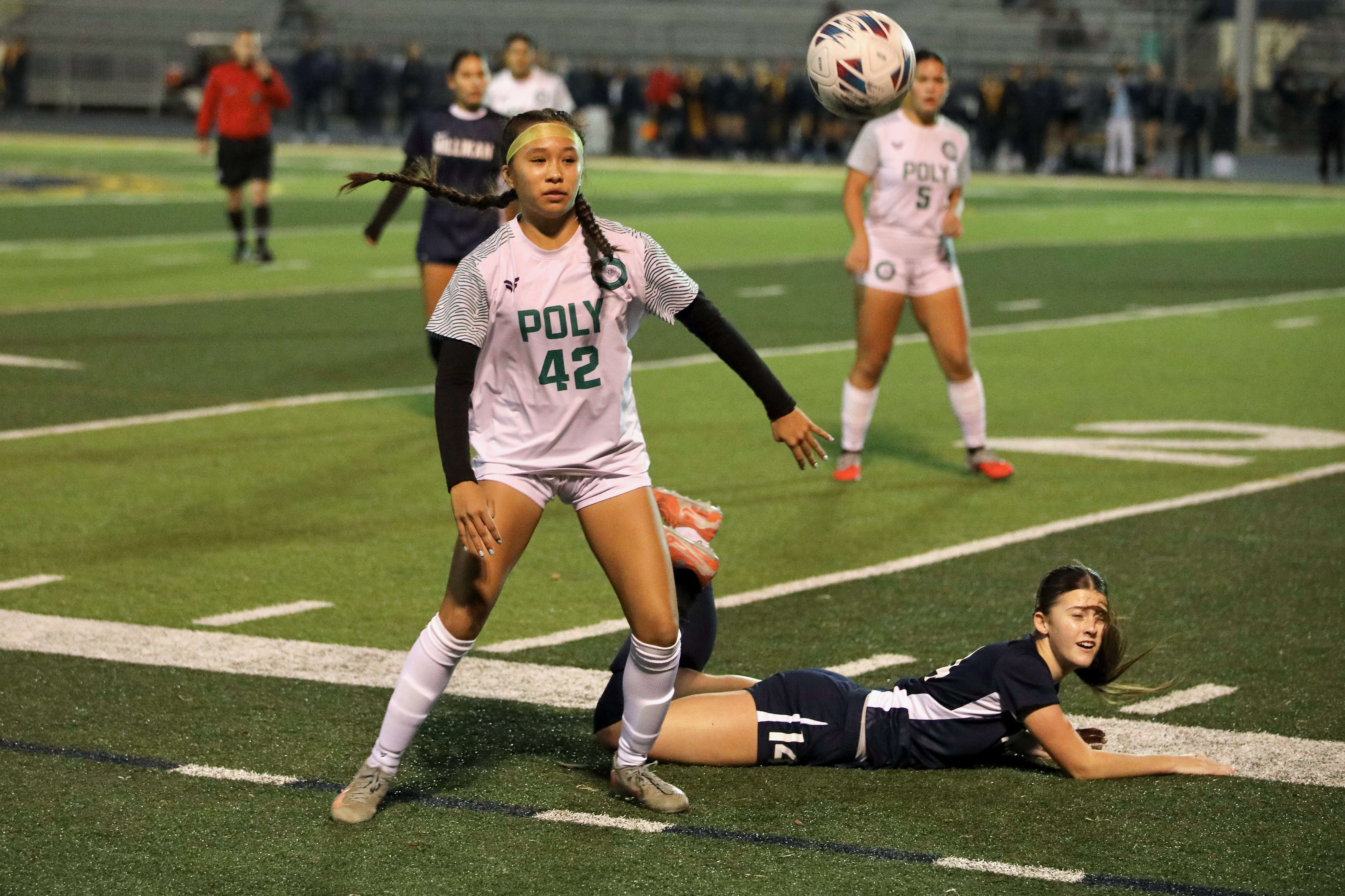 Millikan’s Caoimhe Tighe takes a fall after being fouled by...