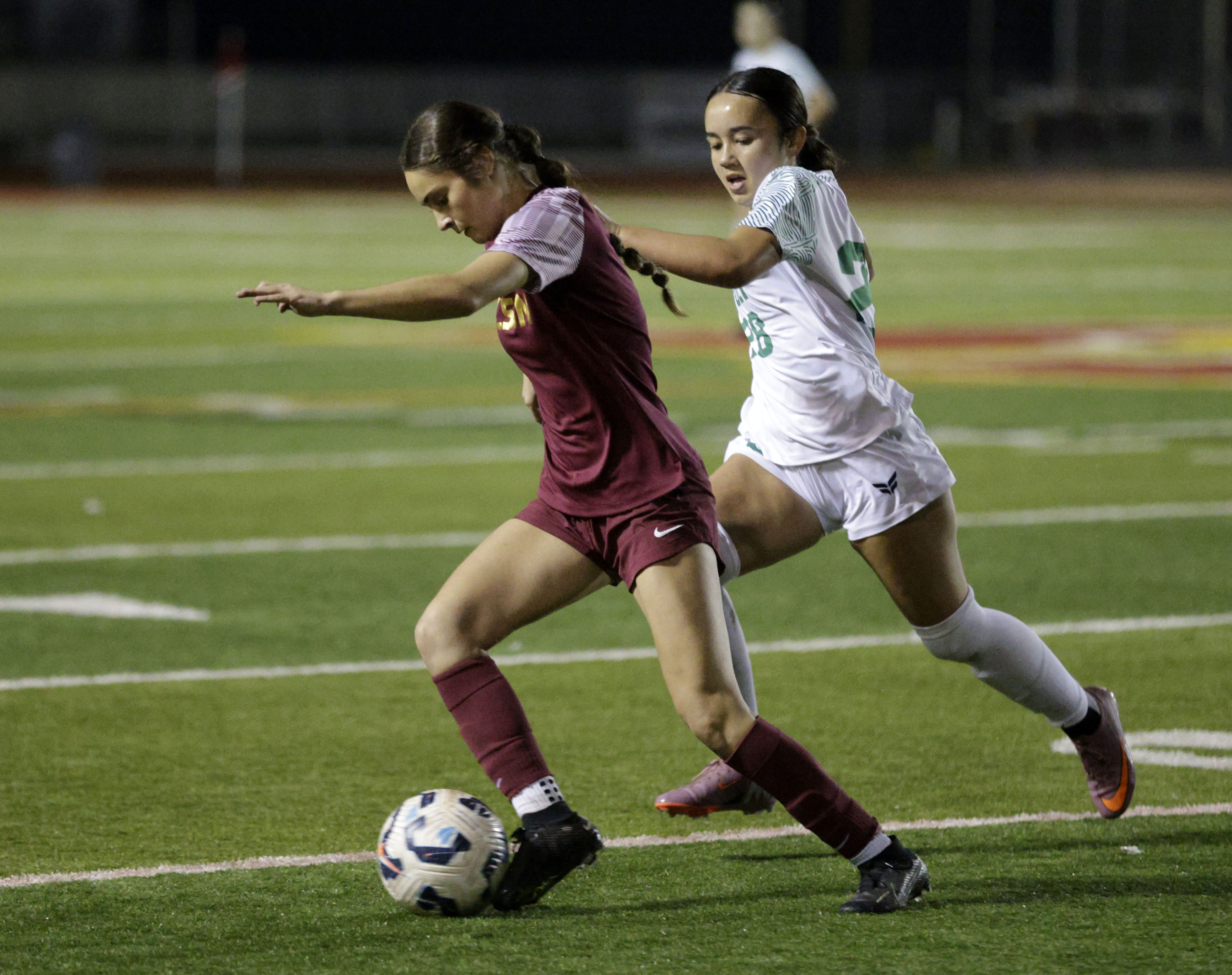 Wilson’s Evan Cassidy (3) tries to keep the ball ahead...