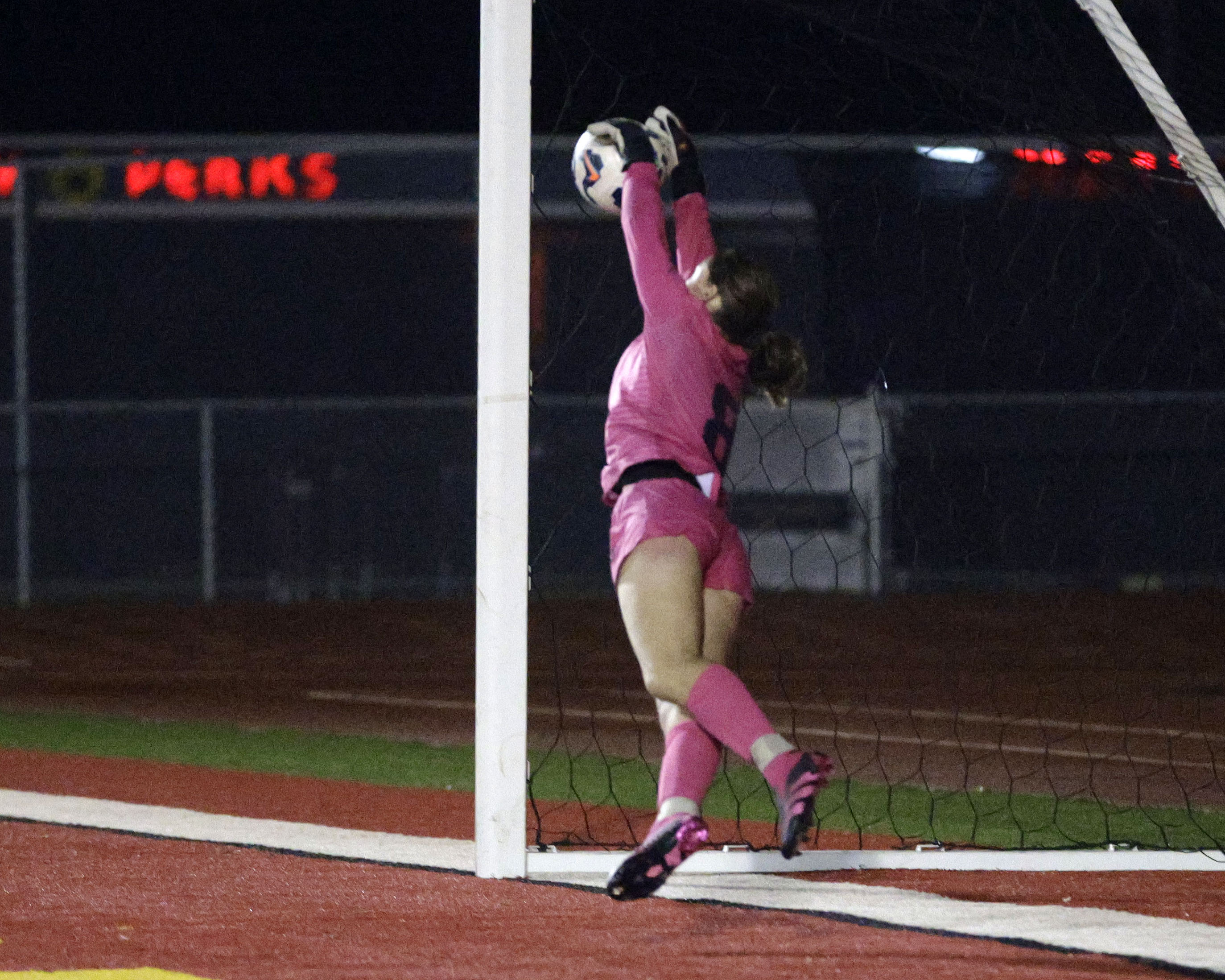 Long Beach Poly goalie Zadie Kuykendal tries to stop a...