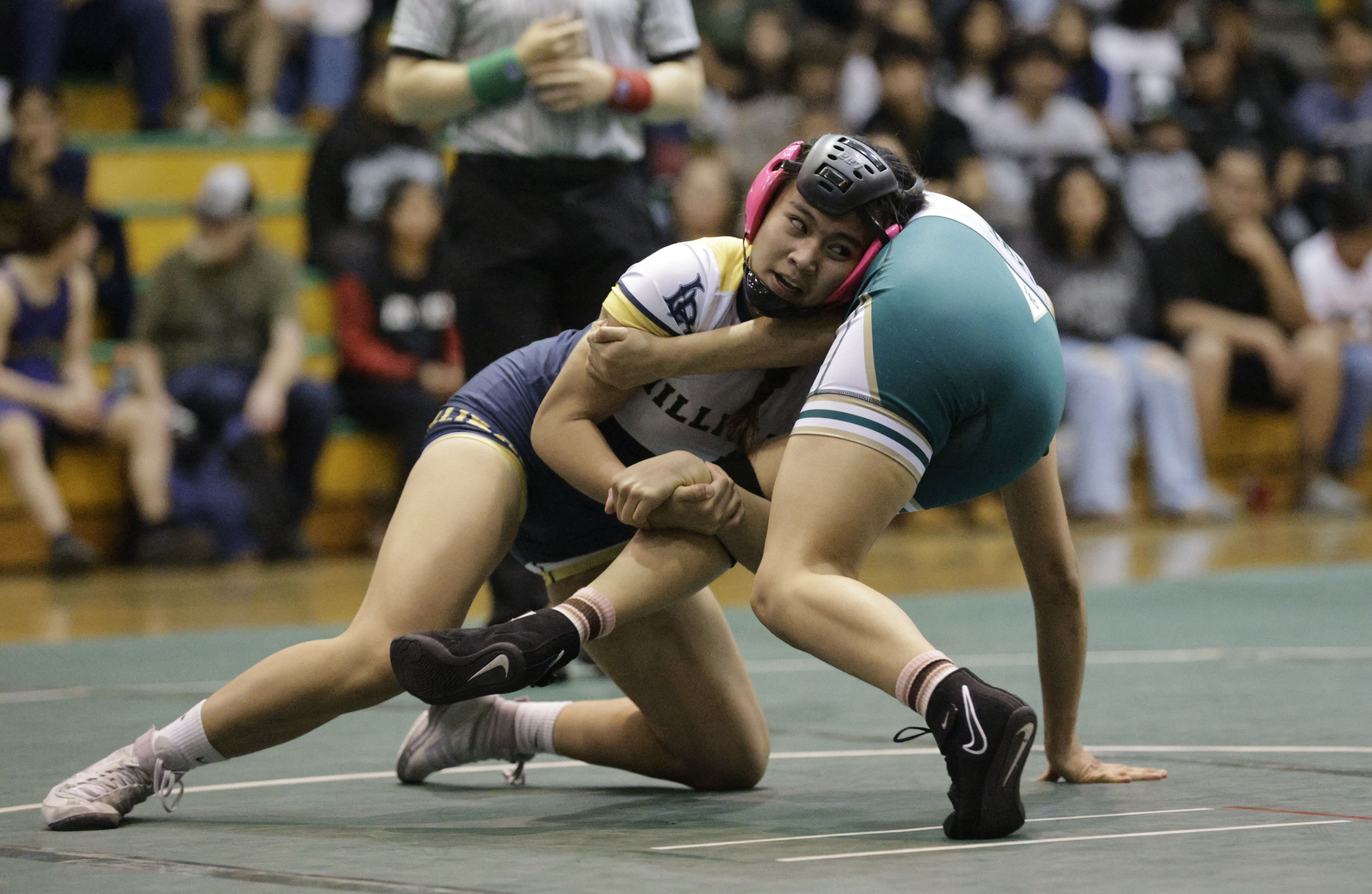 Long Beach Poly’s Kayla Chagala takes on Millikan’s Meg Chelsea...