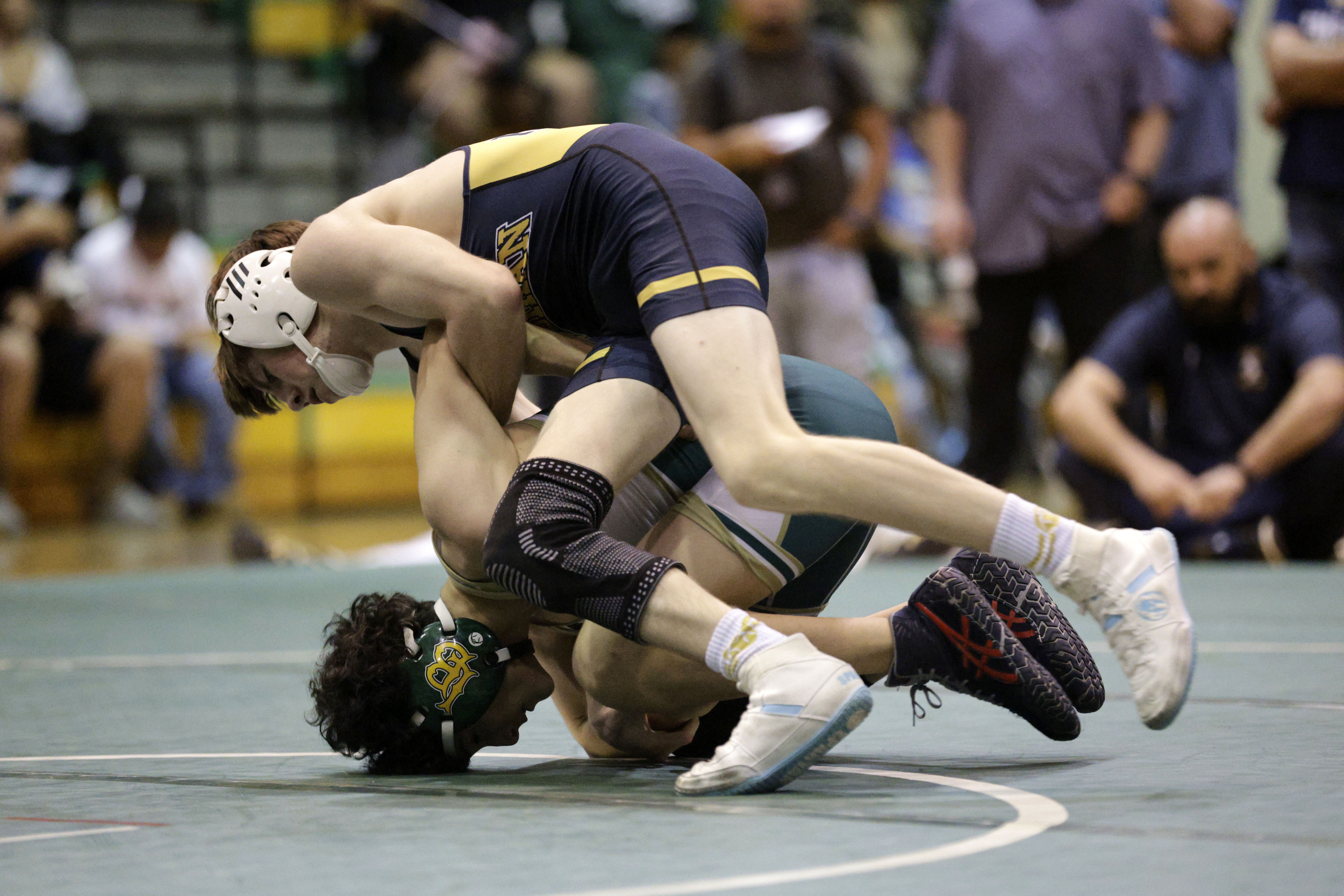 Long Beach Poly’s Martin Ornelas takes on Millikan’s Daniel Cullen...