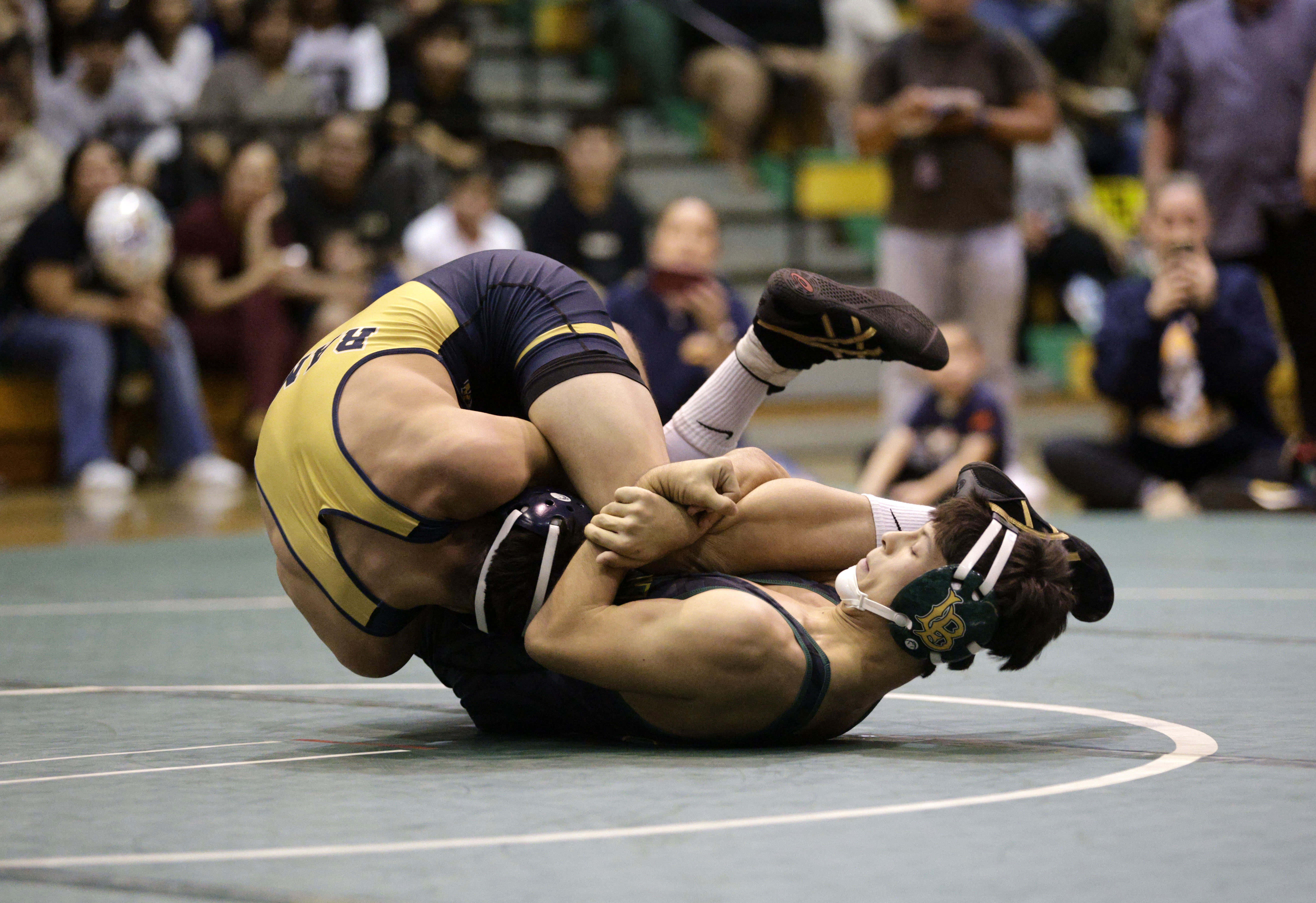 Millikan’s Jimmy Alvarez Jr. takes on Long Beach Poly’s Lincoln...