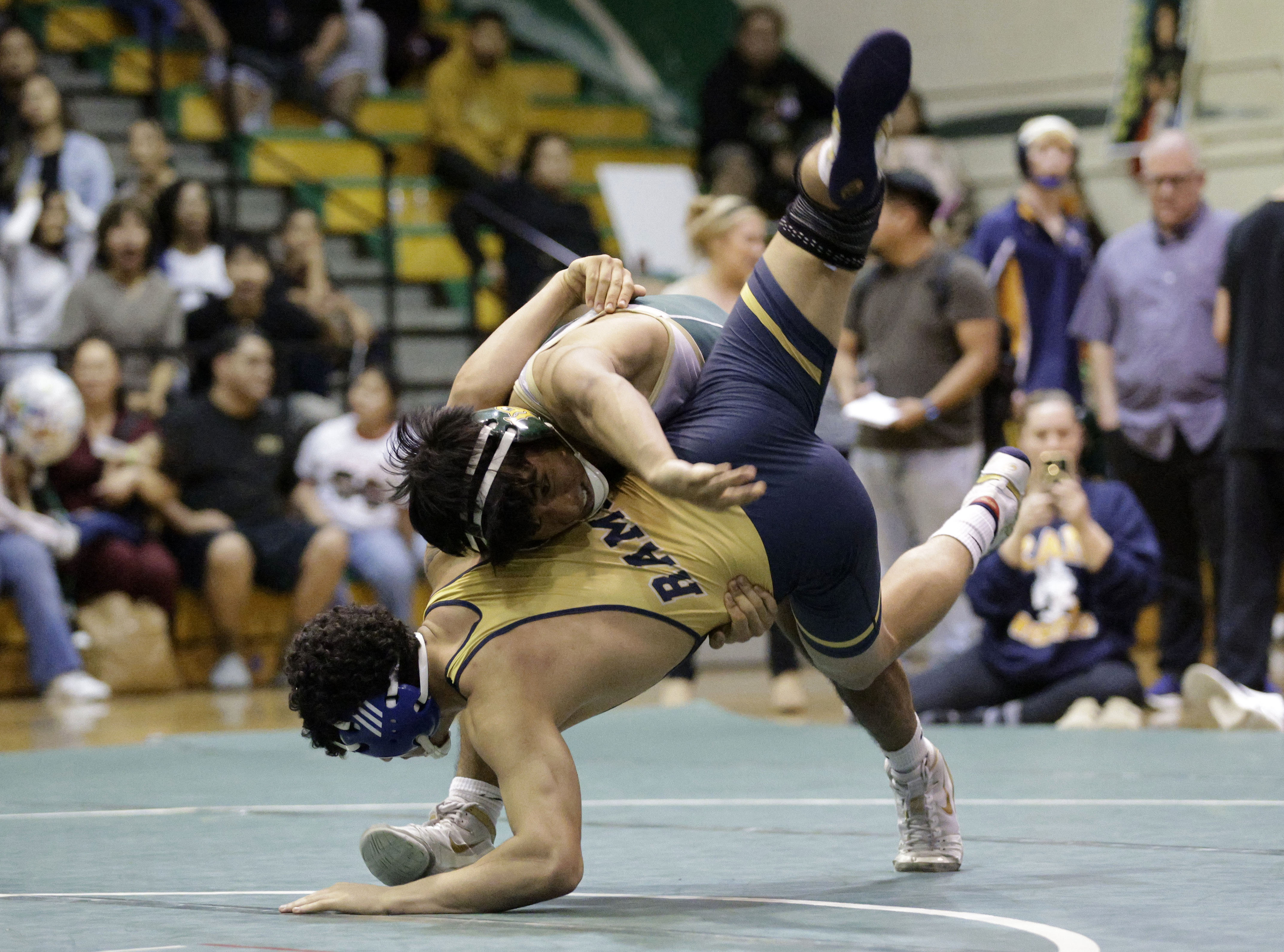 Millikan’s Malid Sharif takes on Long Beach Poly’s Jayden Al...