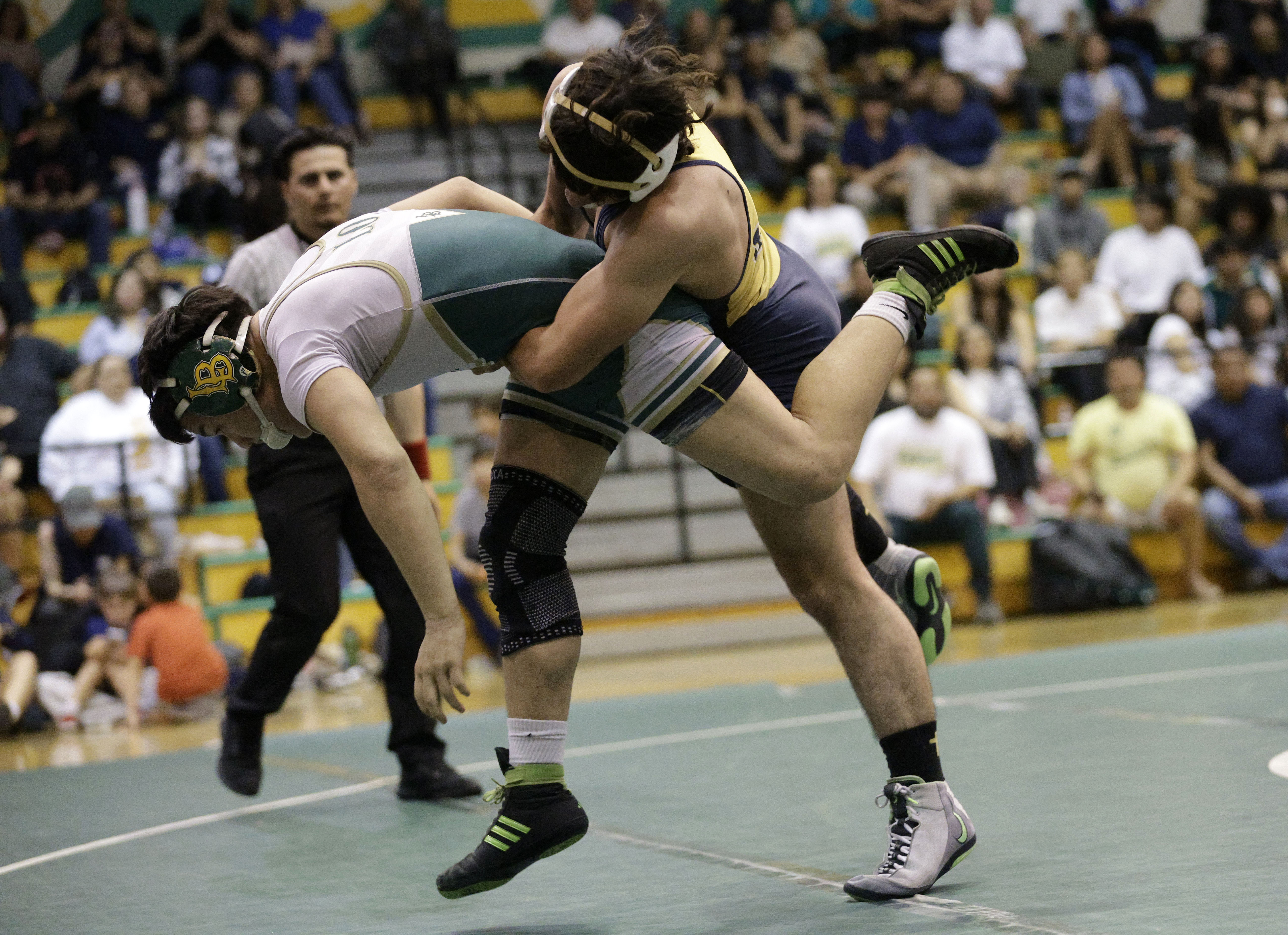 Millikan’s Jason Fiala takes on Long Beach Poly’s Rocky Lo...