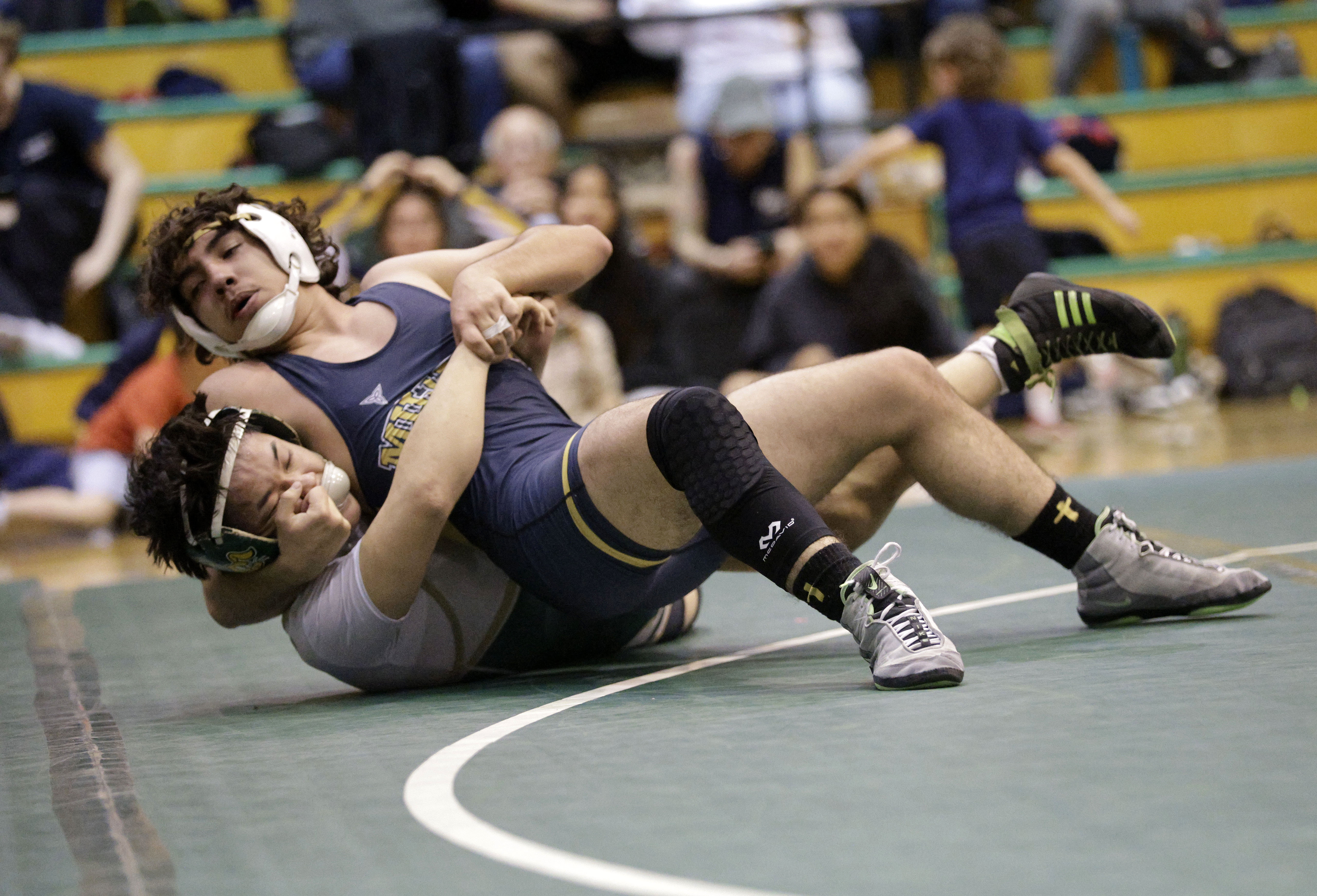 Millikan’s Jason Fiala takes on Long Beach Poly’s Rocky Lo...