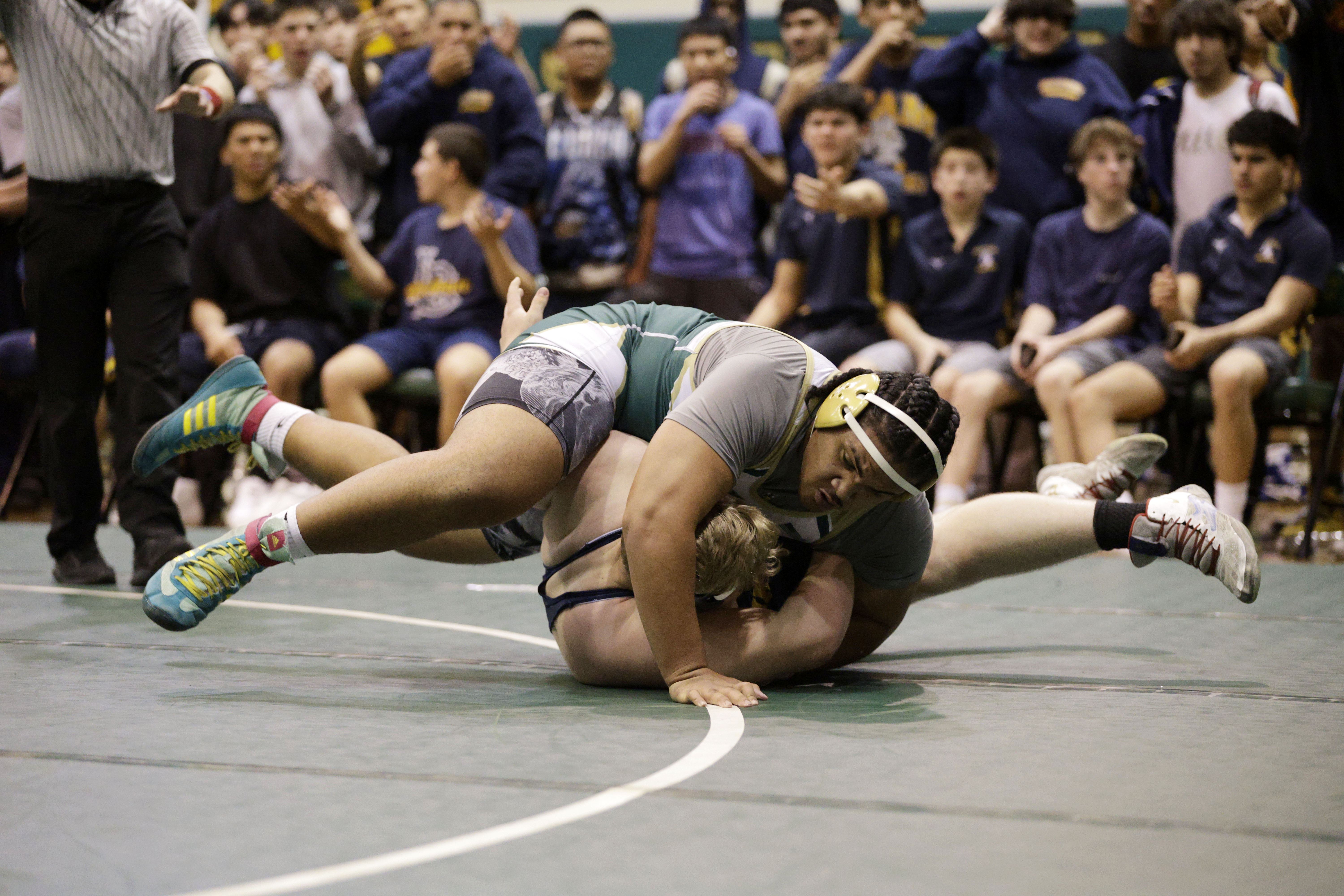 Millikan’s Teagan Rowsell takes on Long Beach Poly’s Sammy Via...