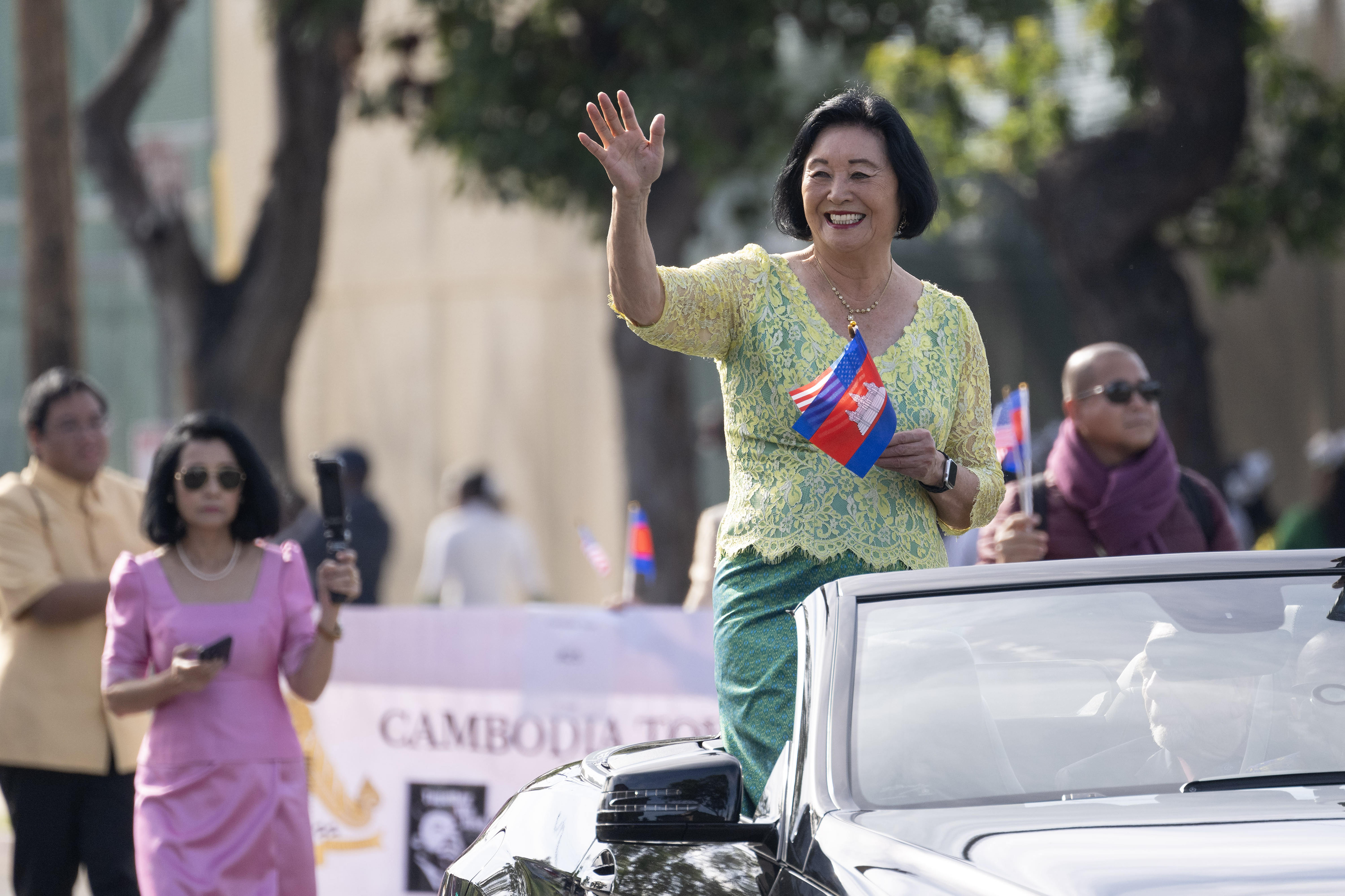 Grand Marshal Mariko Kahn waves to the audience during the...