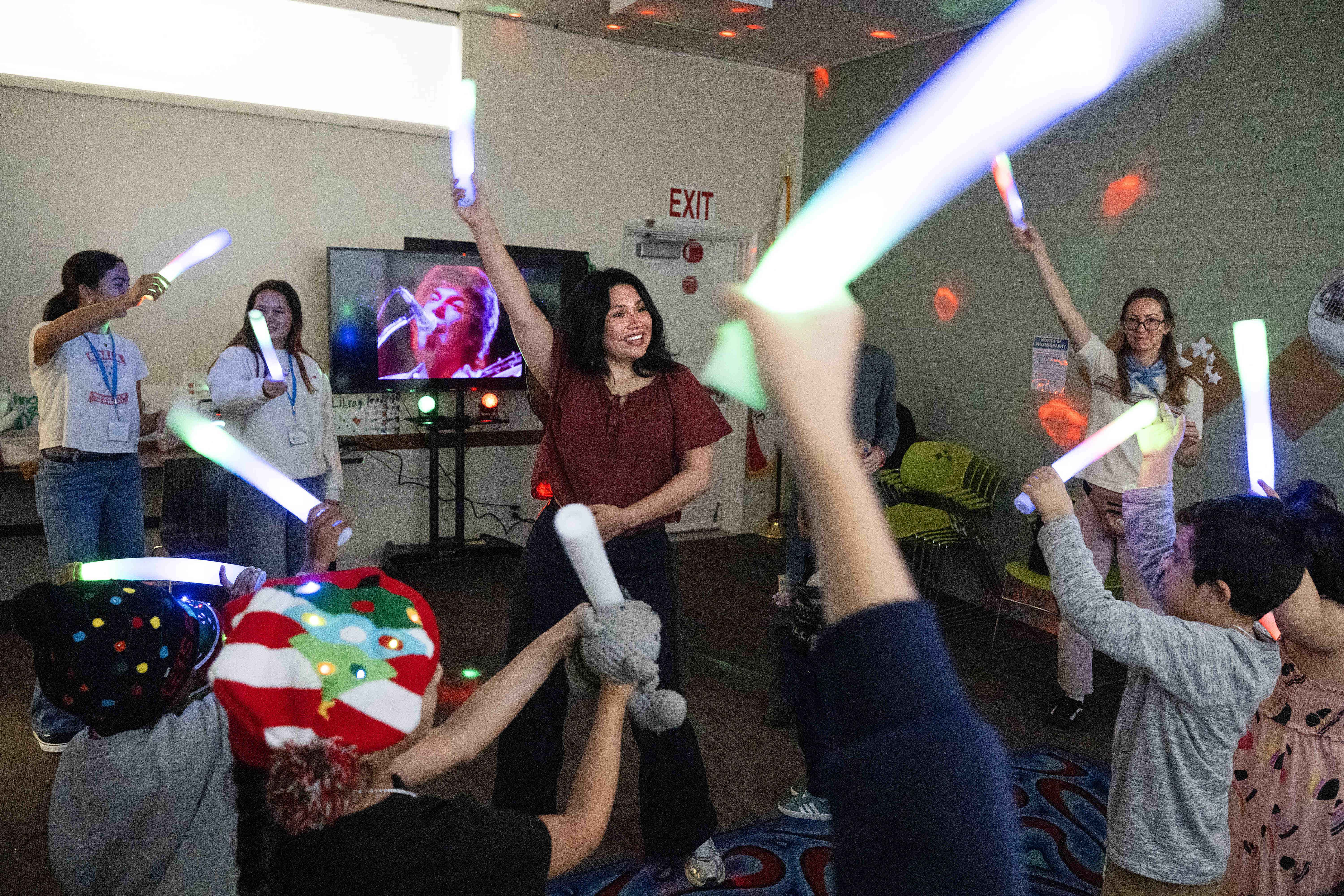 Jeanette Flores leads a dance party during a Noon Yearâs...