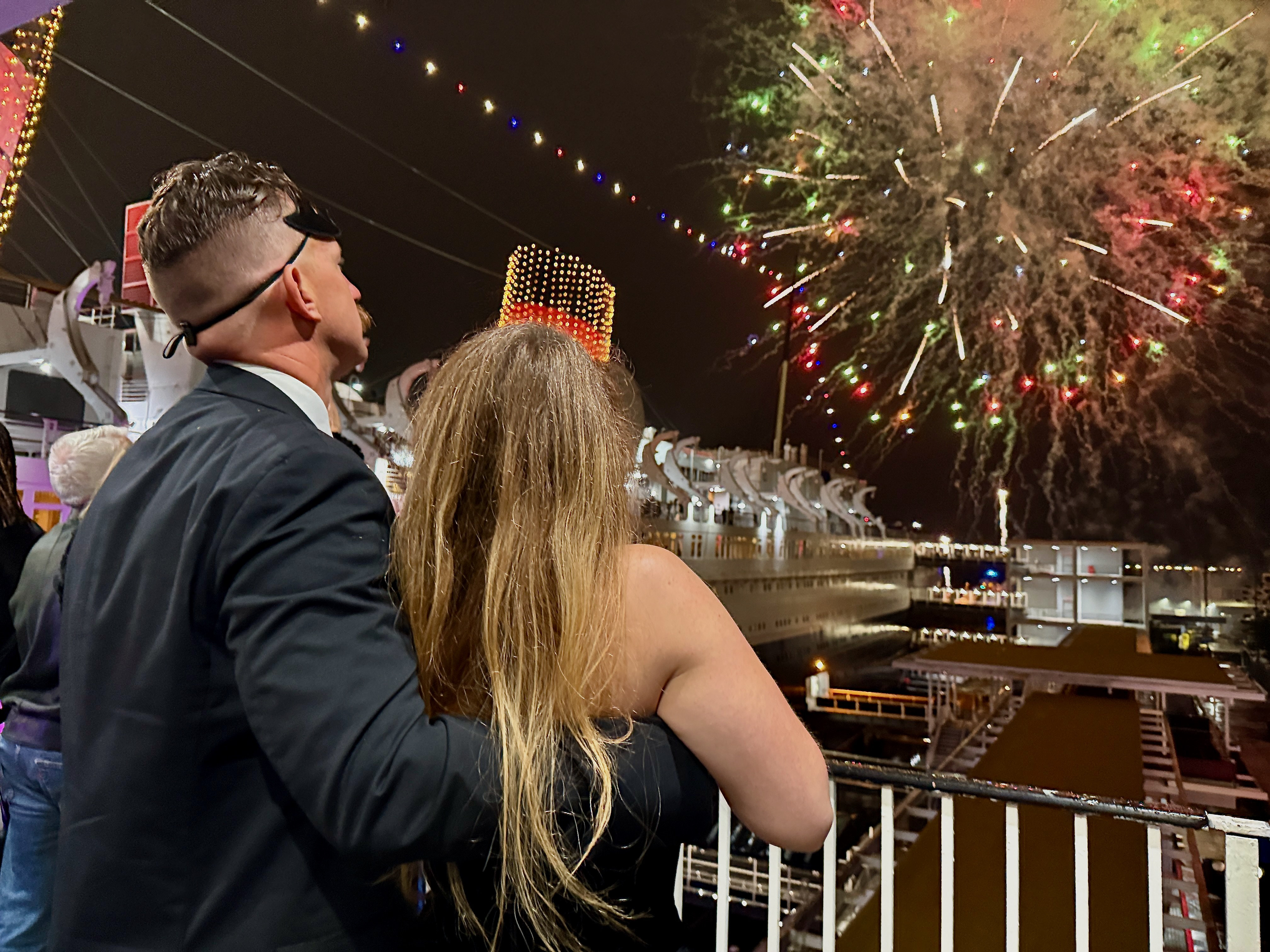 Revelers watch a midnight fireworks show at the Queen Mary...