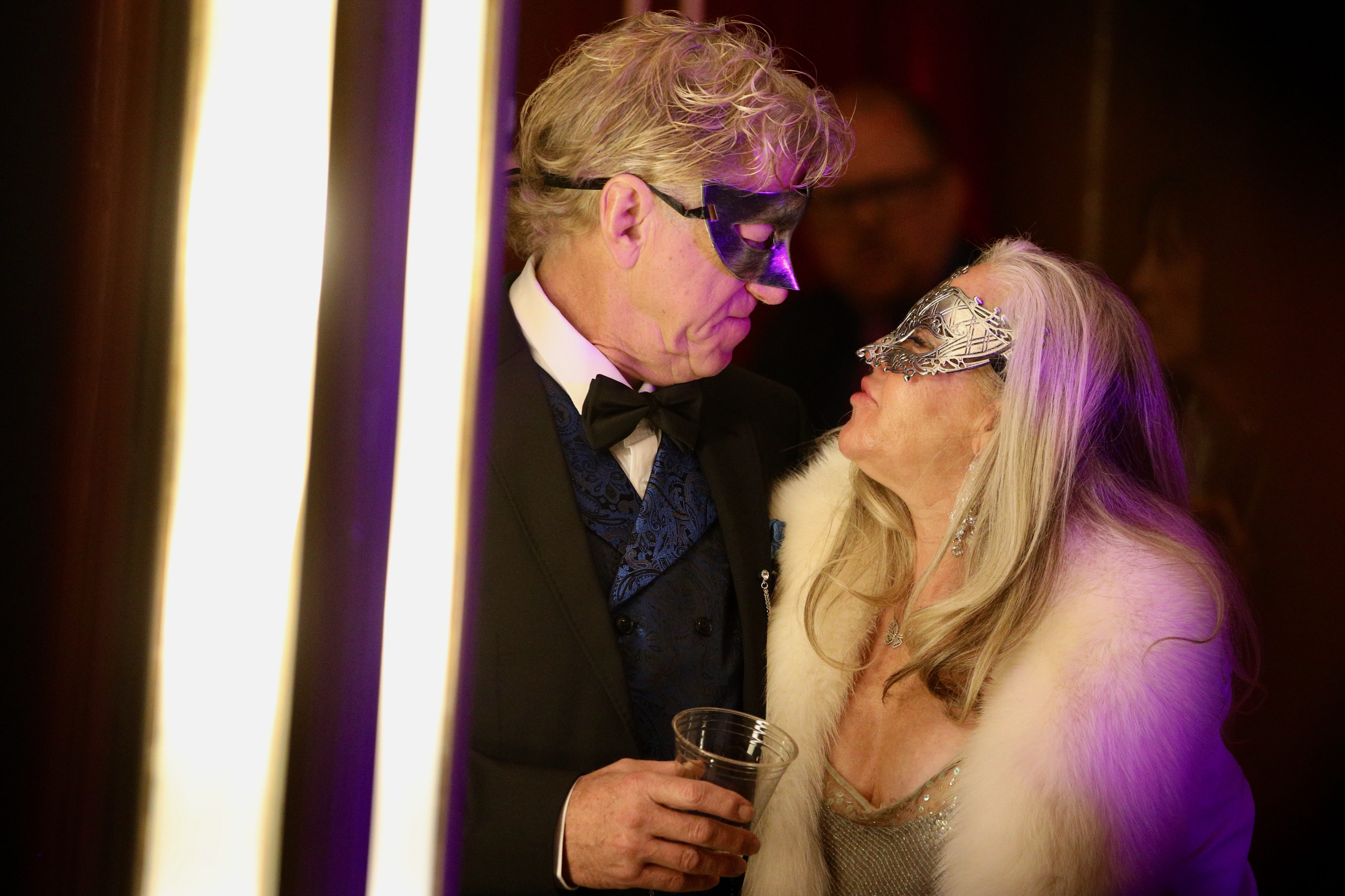 Masquerading revelers celebrate New Yearâs Eve aboard the Queen Mary...