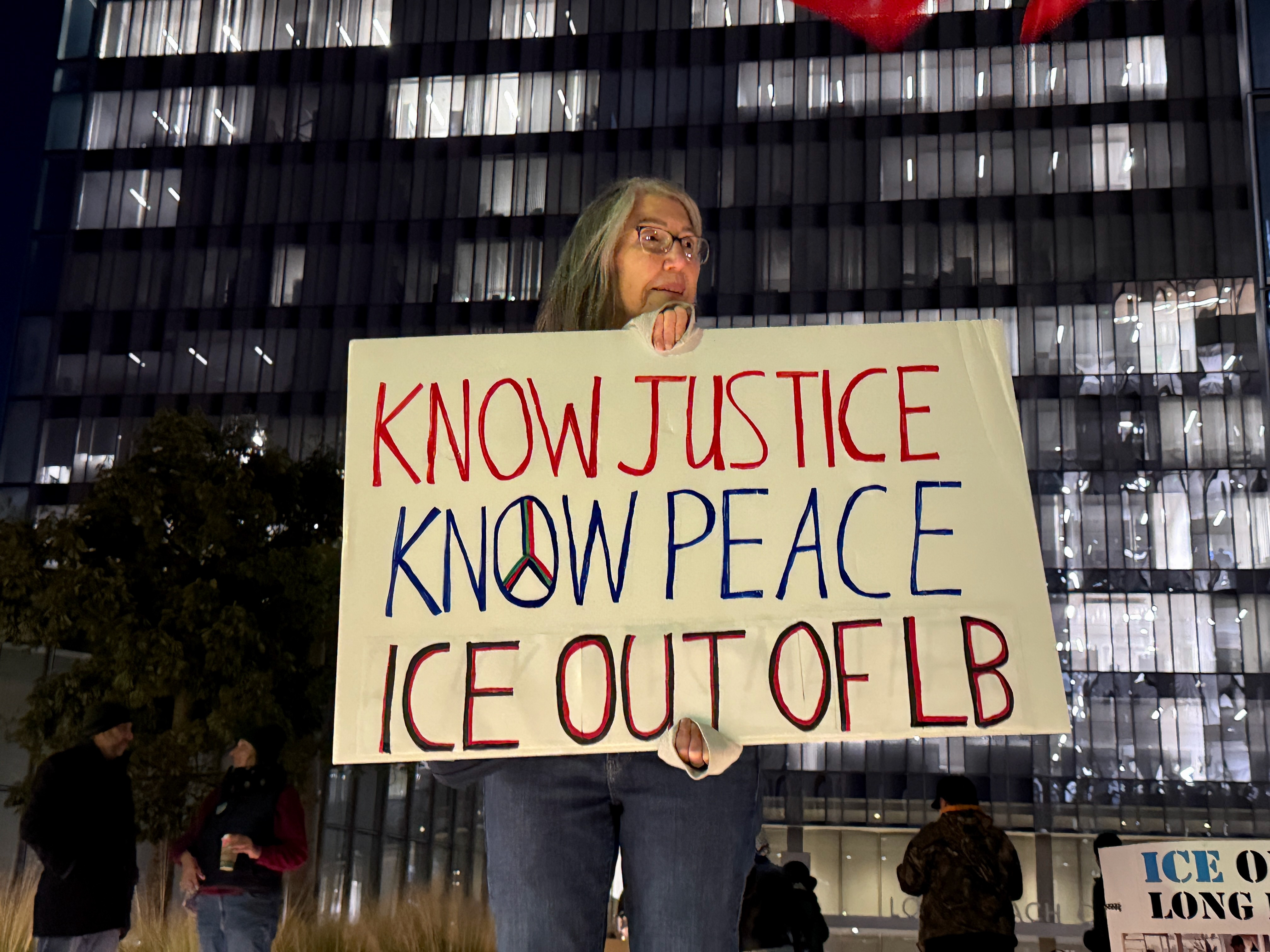 Julie Cucileo of Long Beach joins protesters near Long Beach...