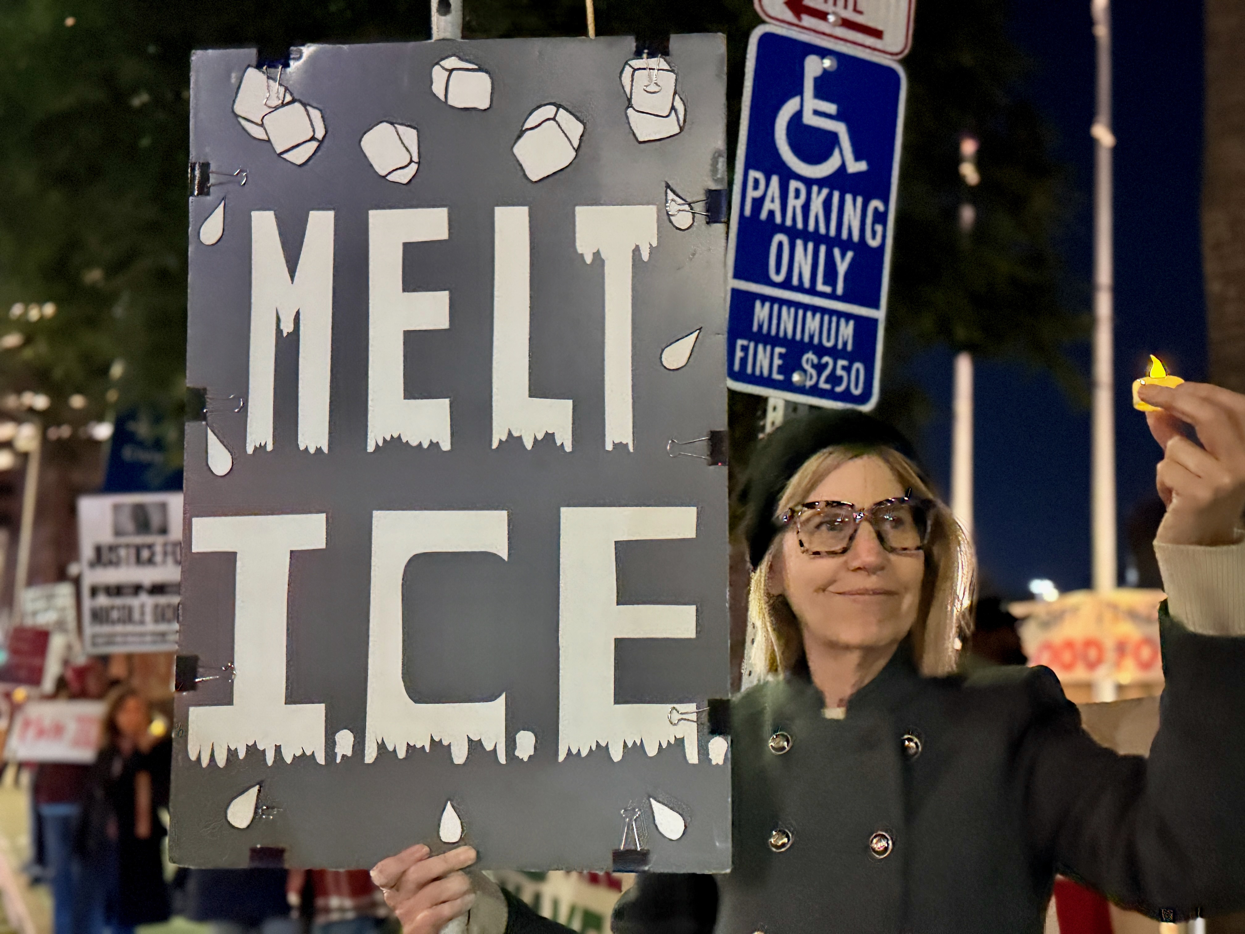 Kay Donato of Long Beach is among the protesters near...