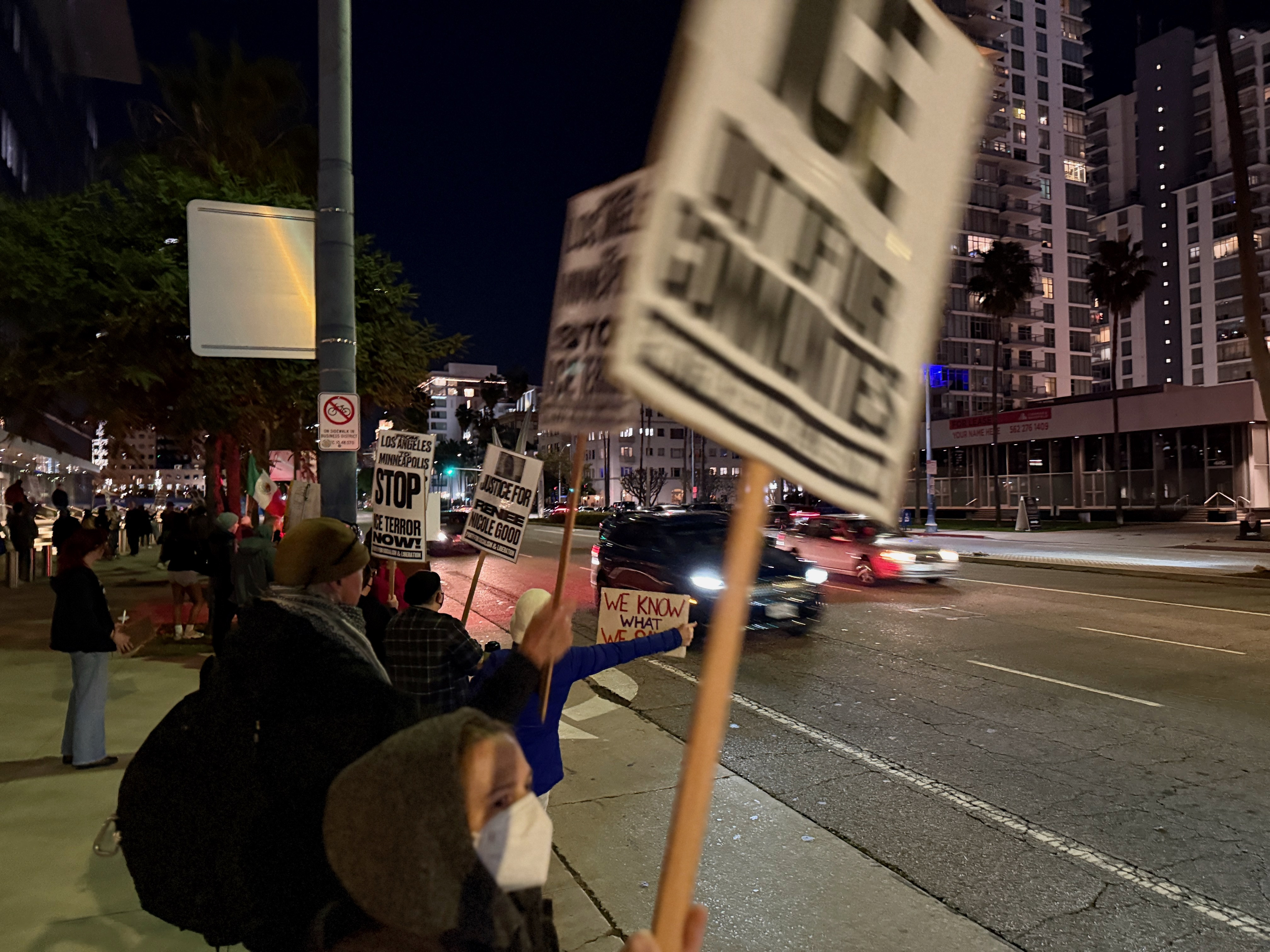 Protesters gather on Ocean Boulevard near Long Beach City Hall...