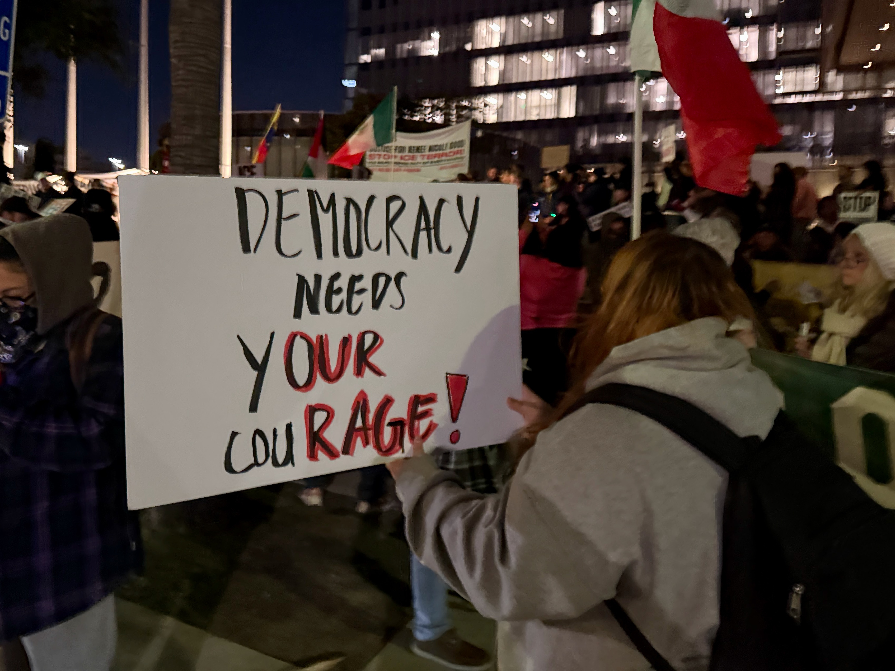 Protesters gather near Long Beach City Hall on Thursday evening,...
