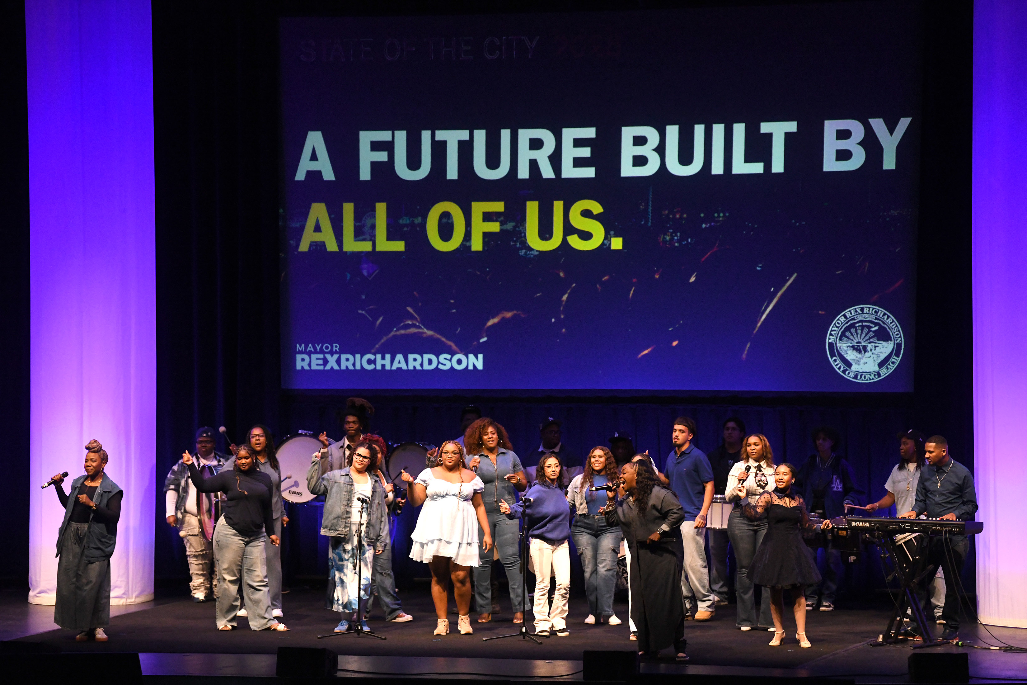 A choir opens the mayorâs State of the City address,...
