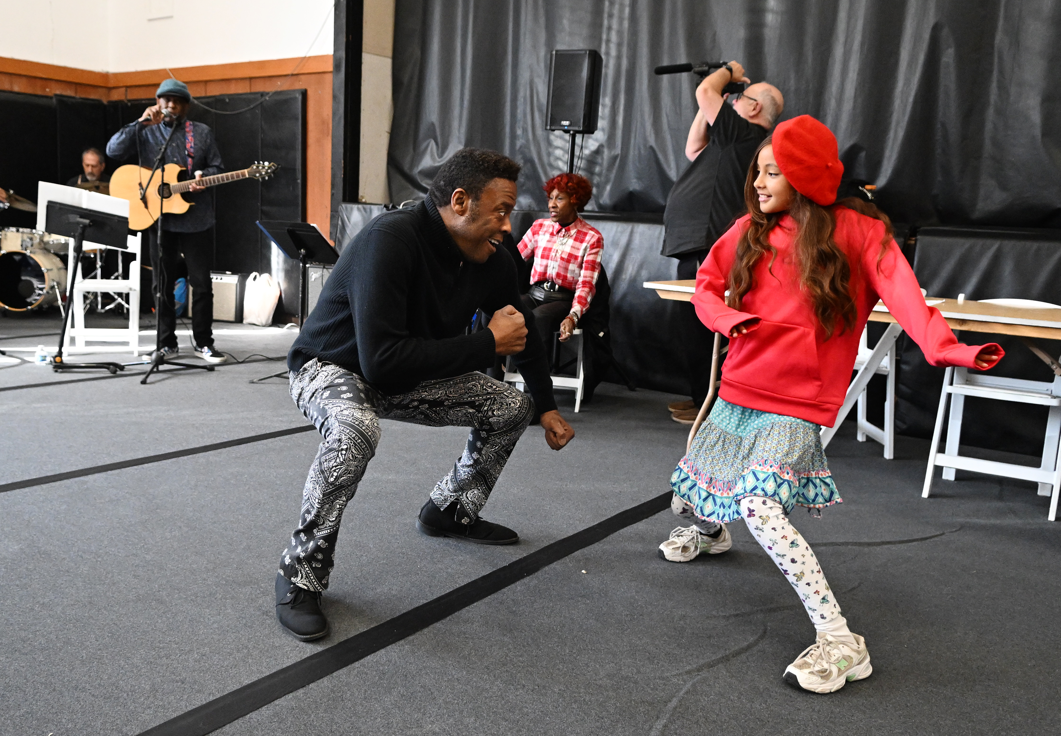 Phillip Percy Williams dances with 10-year-old Paloma Anderson during the...