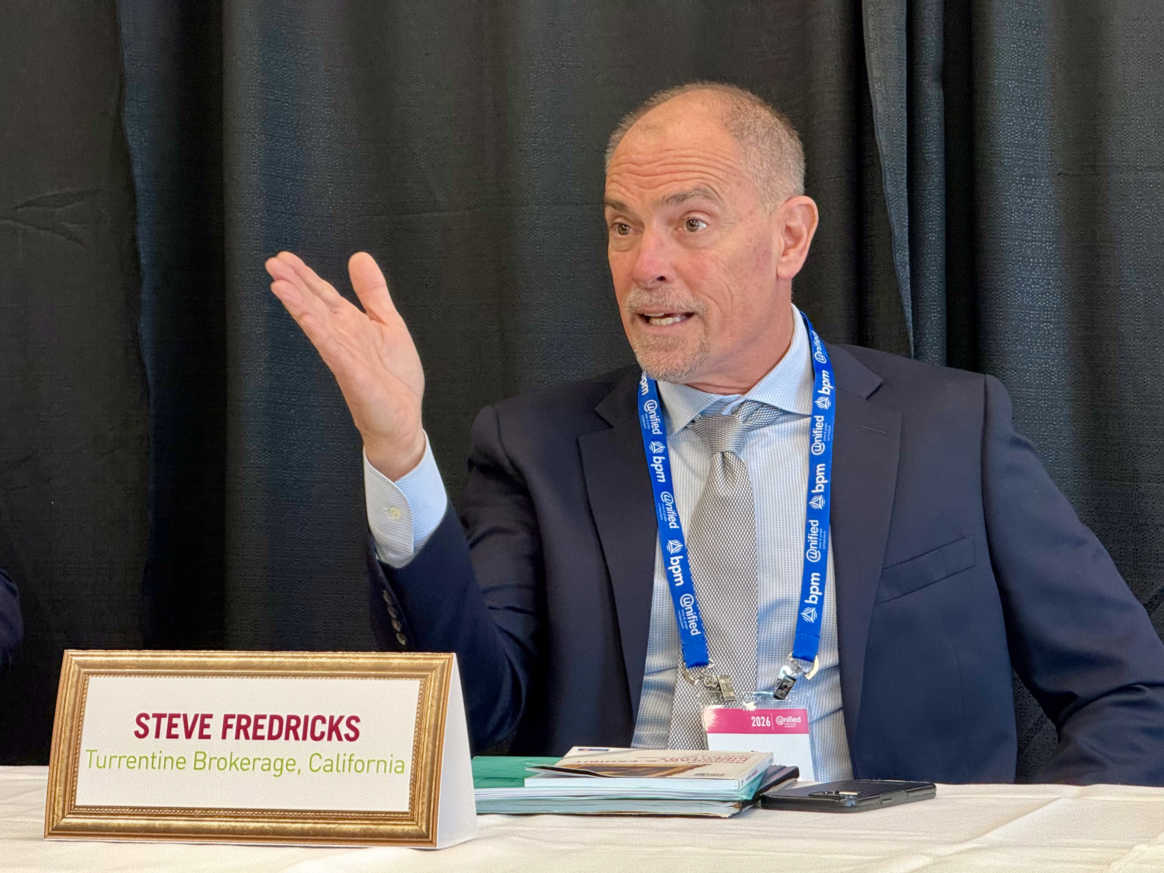 Steve Fredricks, president of Turrentine Brokerage, speaks at a news...