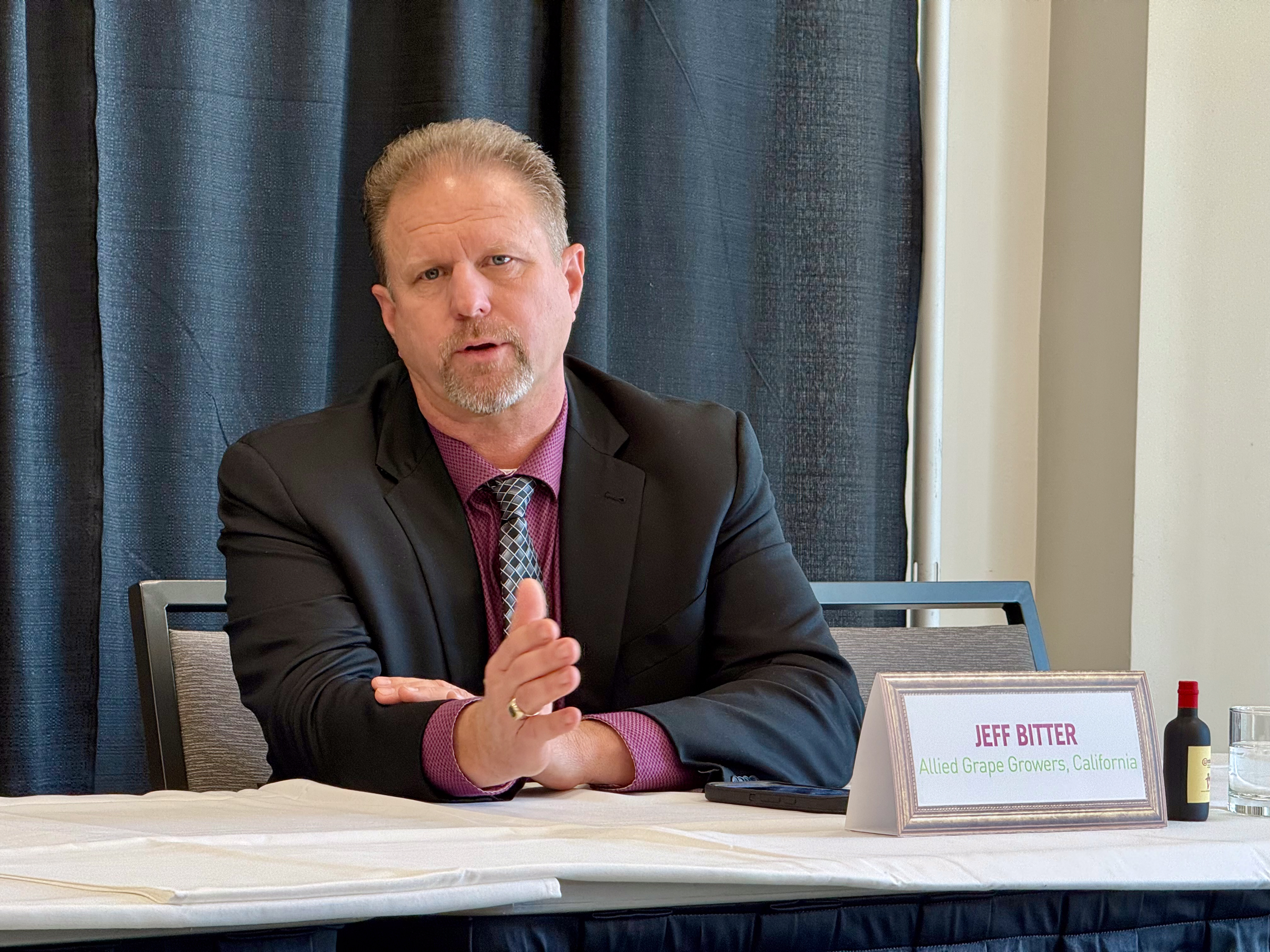 Jeff Bitter, president of Allied Grape Growers, speaks at a...